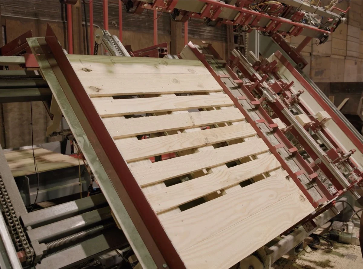 specialty wood palette on machine being nailed together