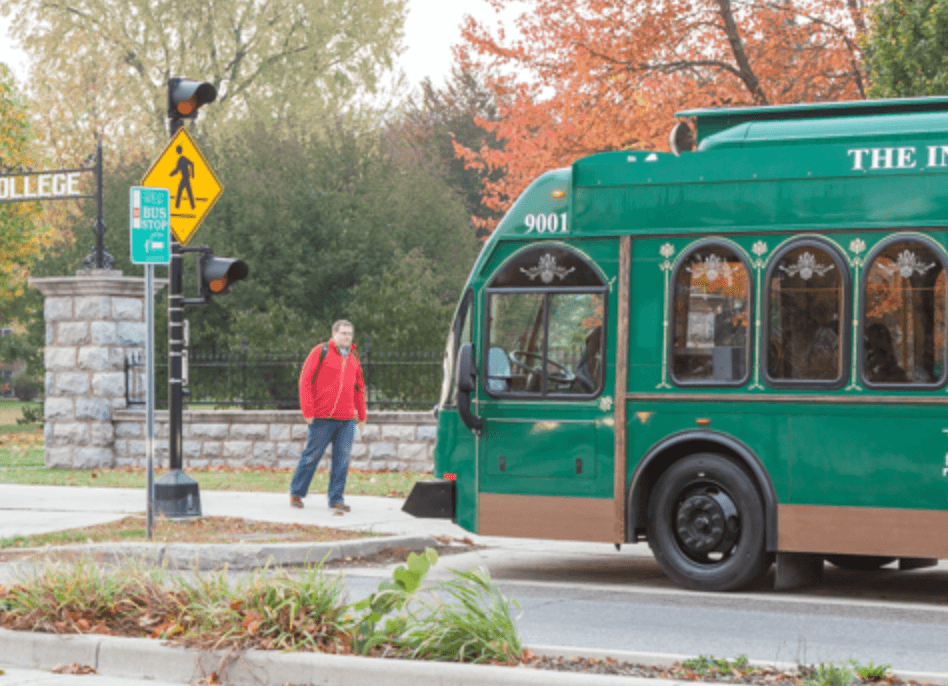 person walking to trolley