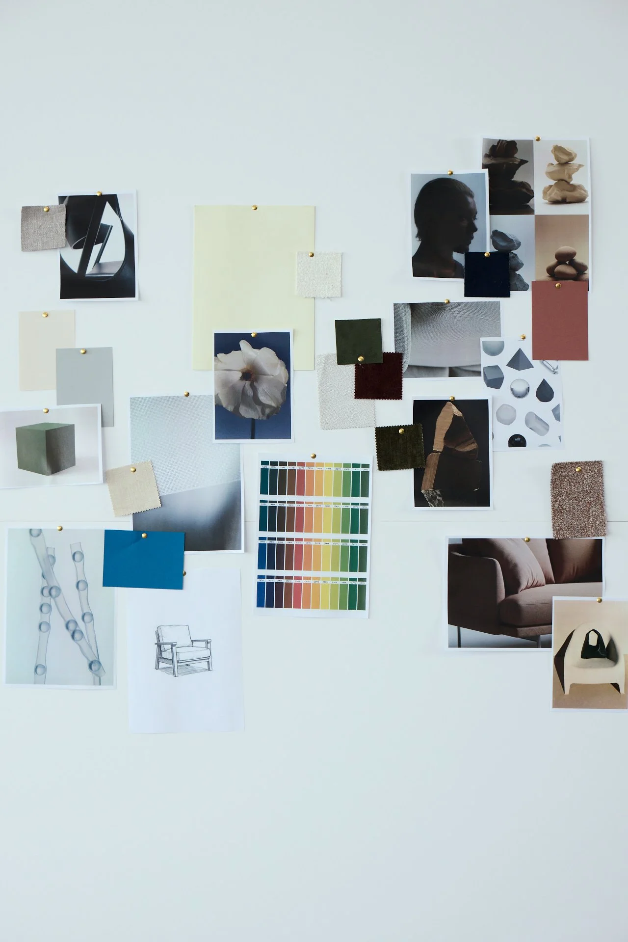 Mood board with fabric swatches, paint color palettes, interior design sketches, and photographs of furniture and decor items.