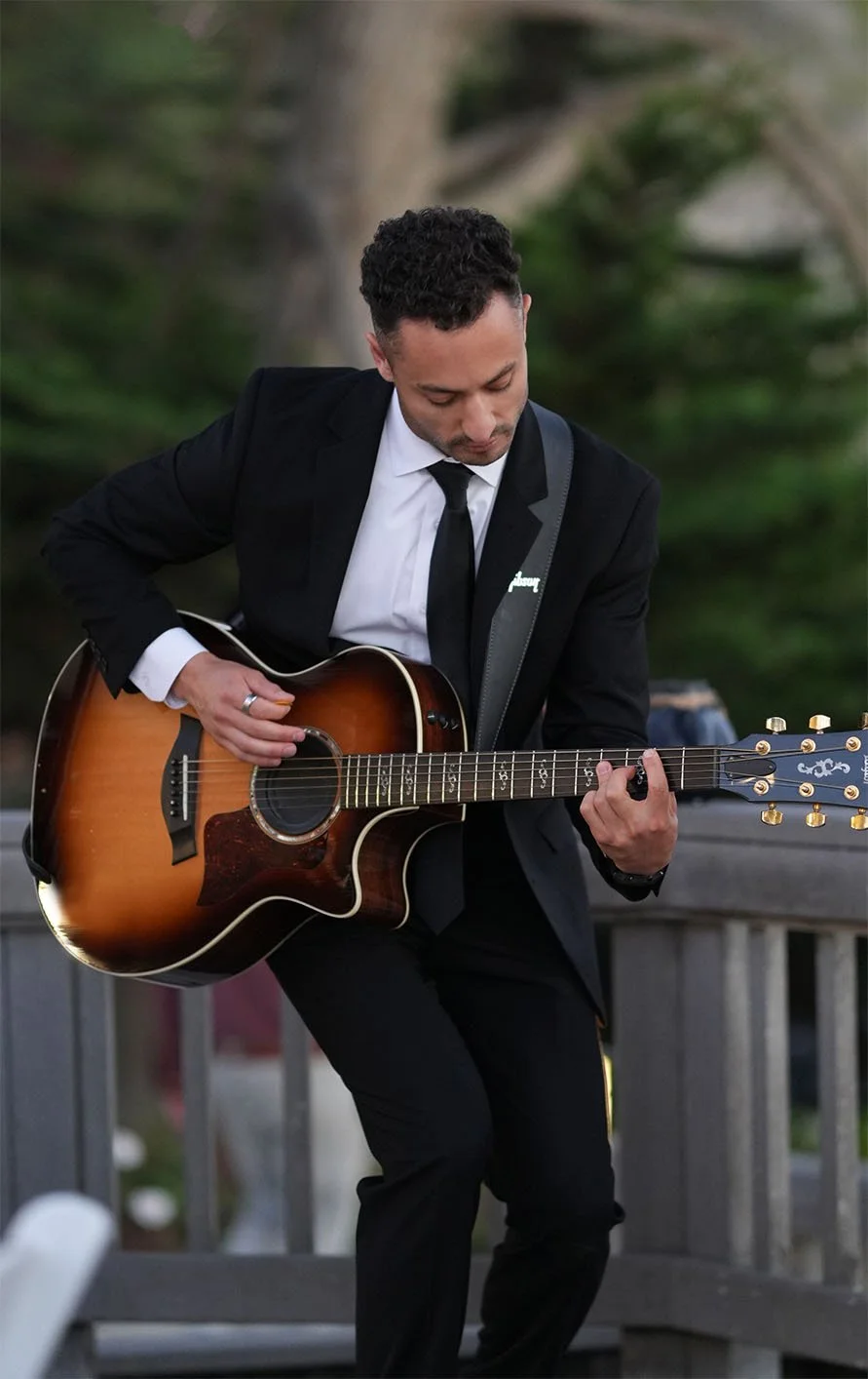 Close up shot of Michael Hill playing guitar at a san diego wedding
