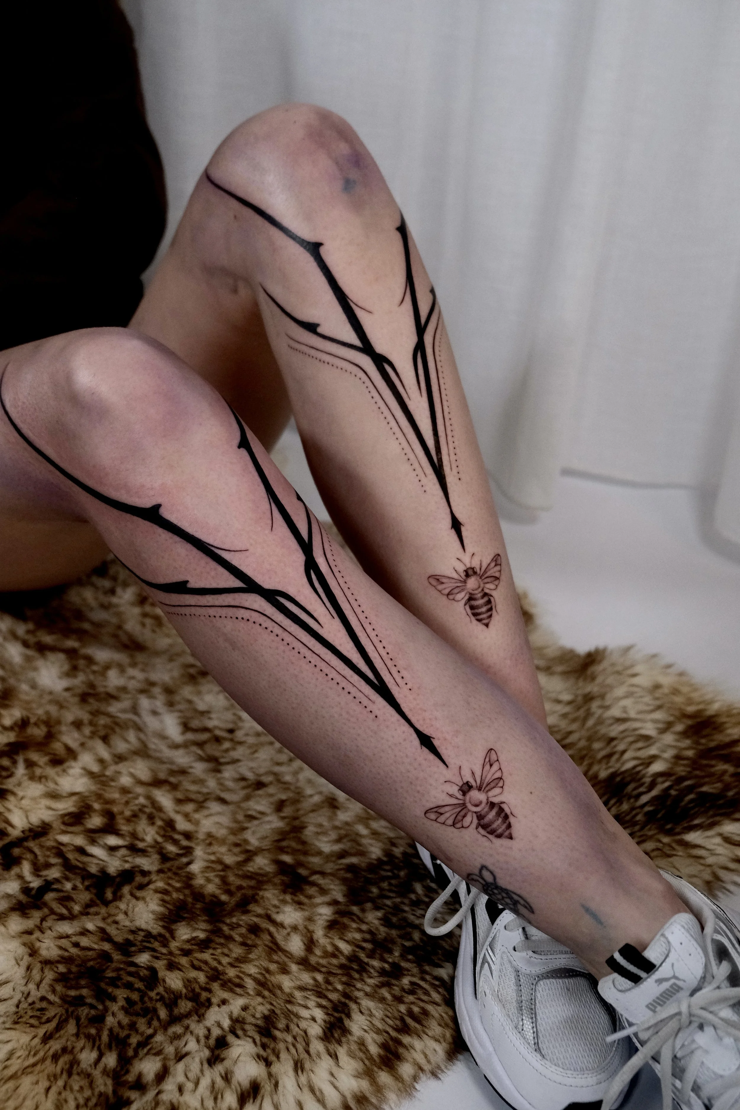 blackwork ornamental leg tattoos