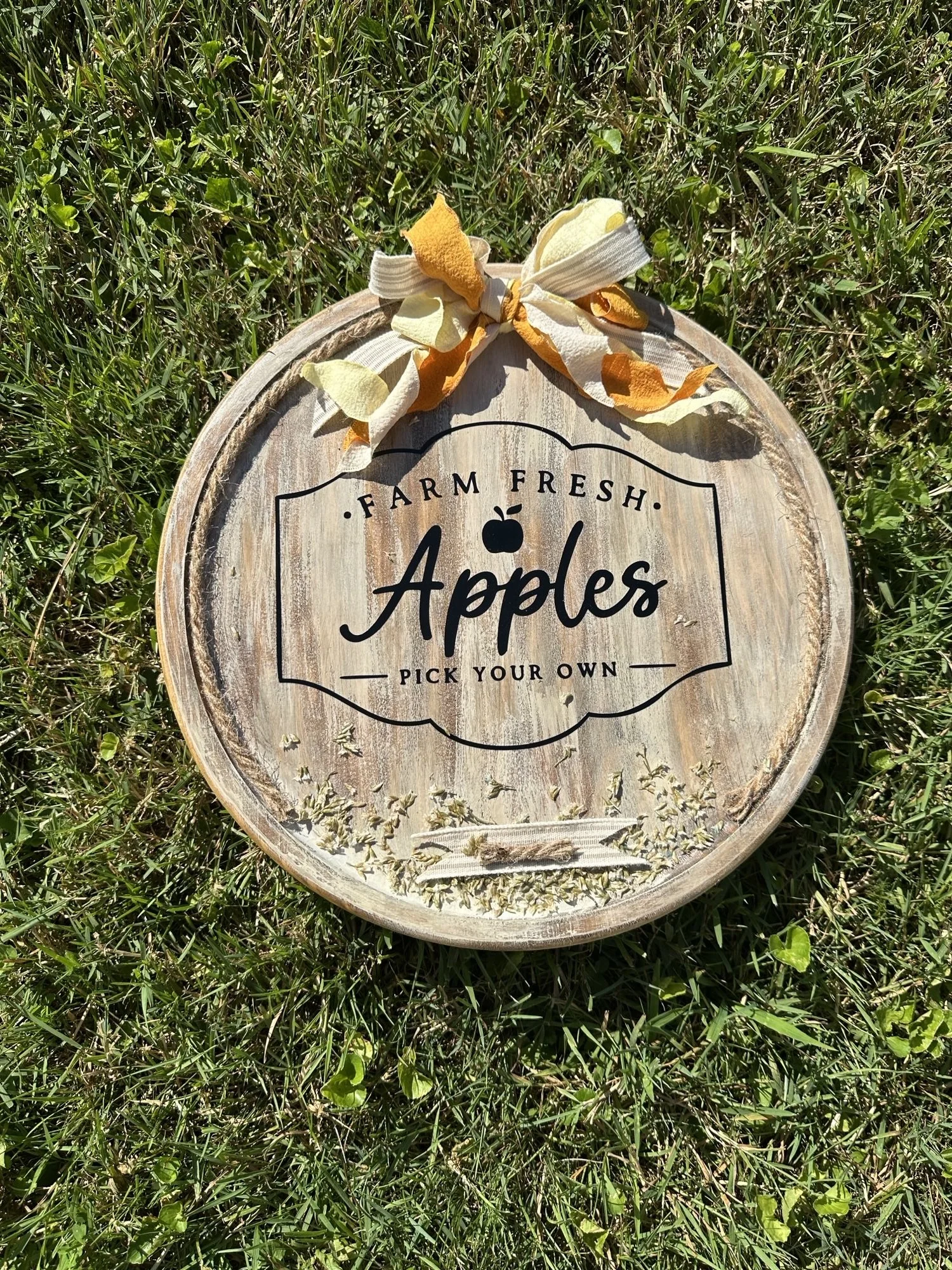 a wooden sign that says "Farm Fresh Apples pick your own"