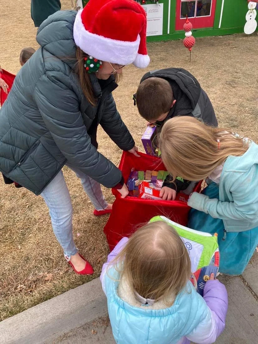 Leah Playing Santa in Downtown Parker