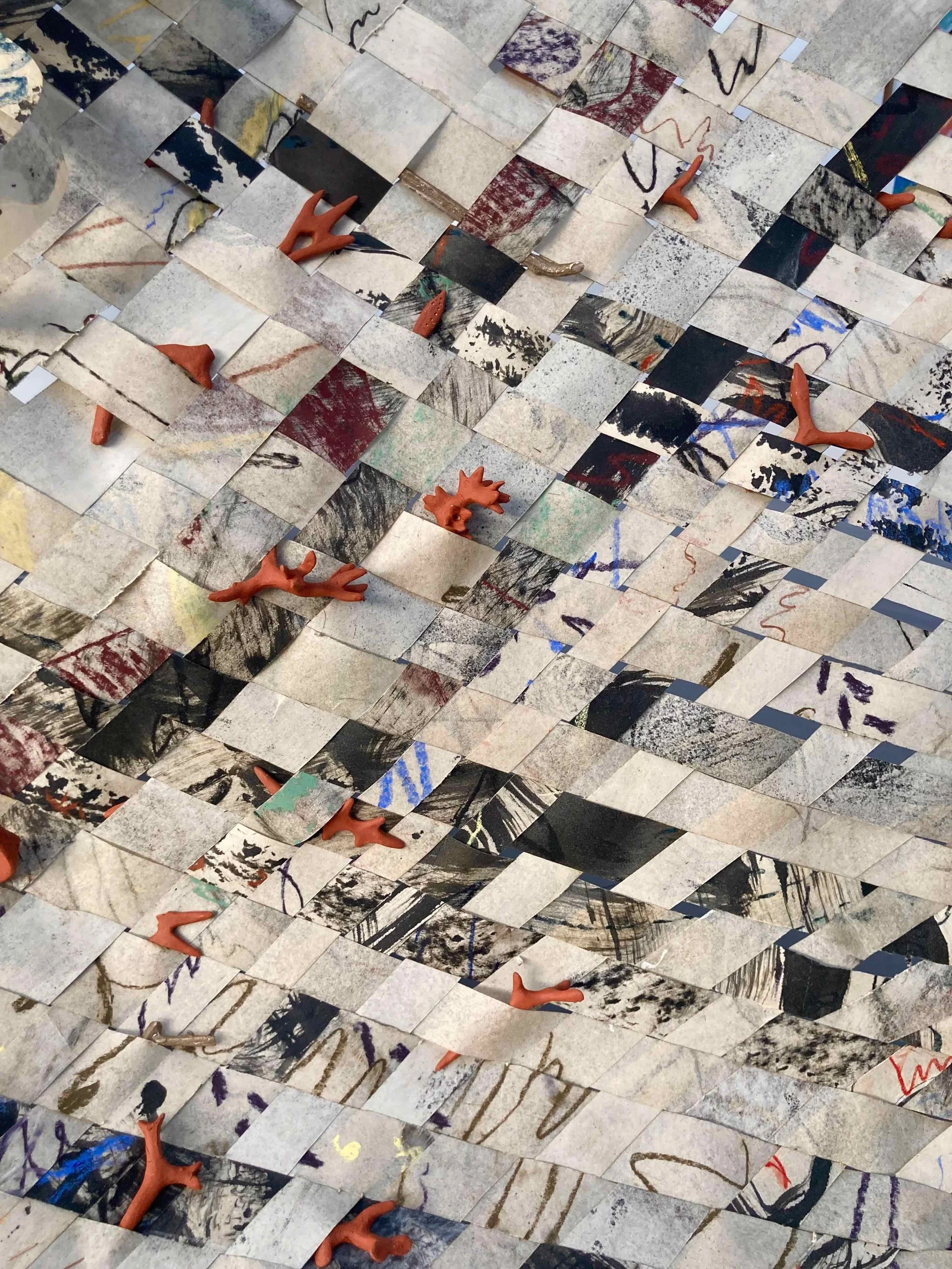 Weaving with wild clay objects and prints.jpg