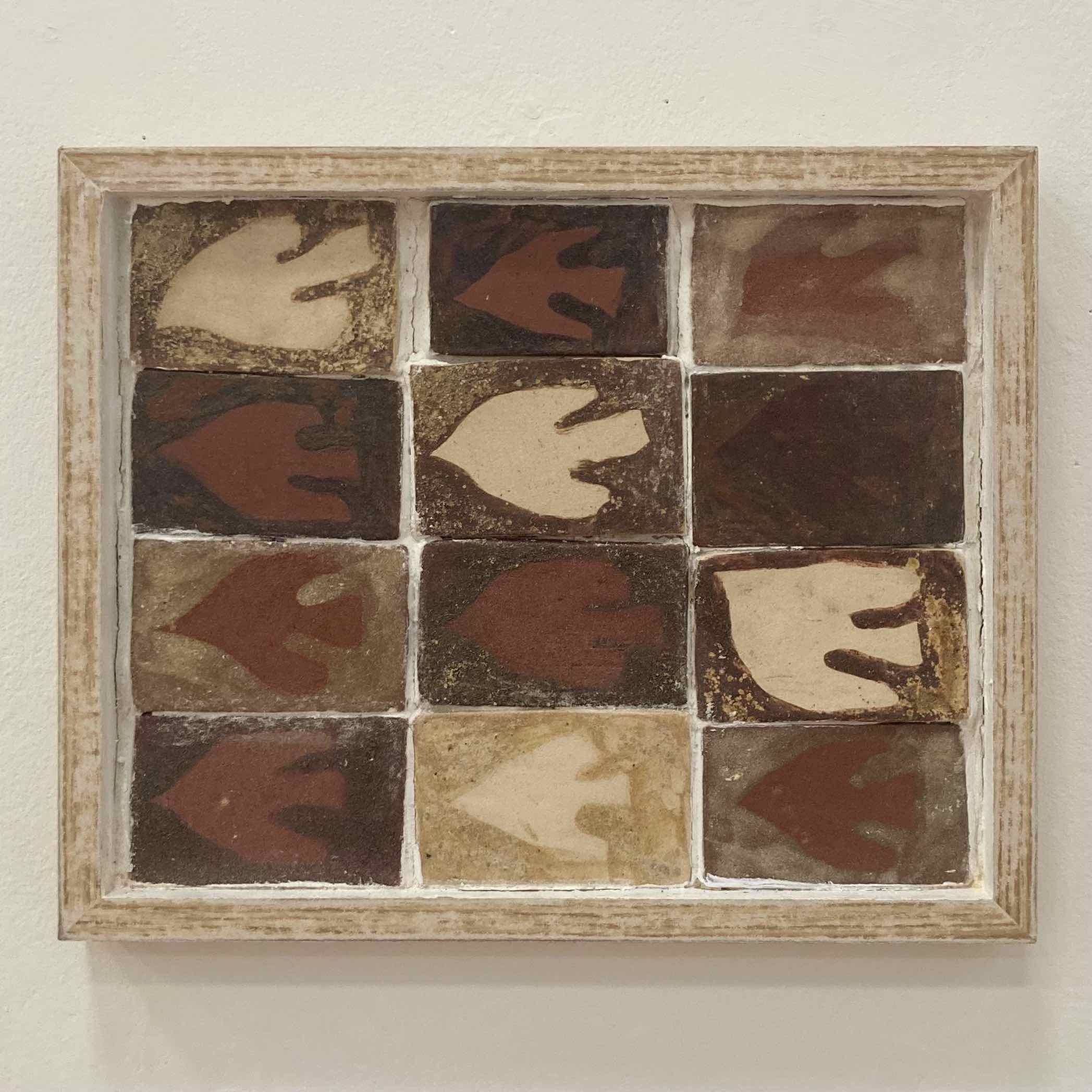 Tiles made from multiple different sources of wild clay, glazed with different combinations of willow and gorse ash and ground limit shells. Grouted within a wooden frame. Pictured on display at Founding at SAW. 15cmx25cm..jpg