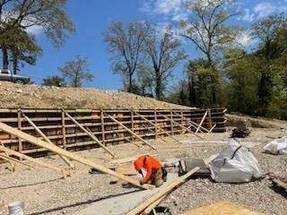 Site preparation and formwork for a rebar reinforced concrete perimeter wall in Little Rock AR.
