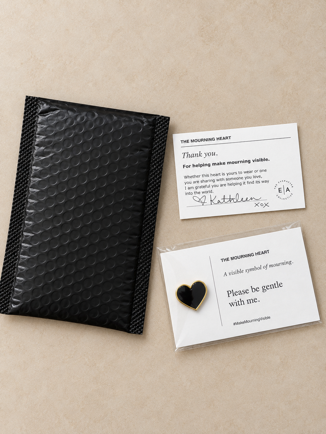Black Mourning Heart pin on its information card with a thank-you note and black mailing envelope.