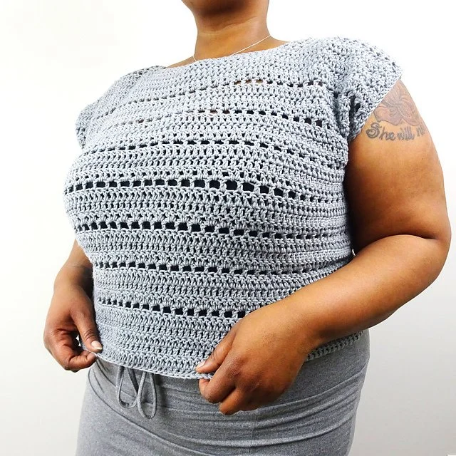 woman wearing crochet top