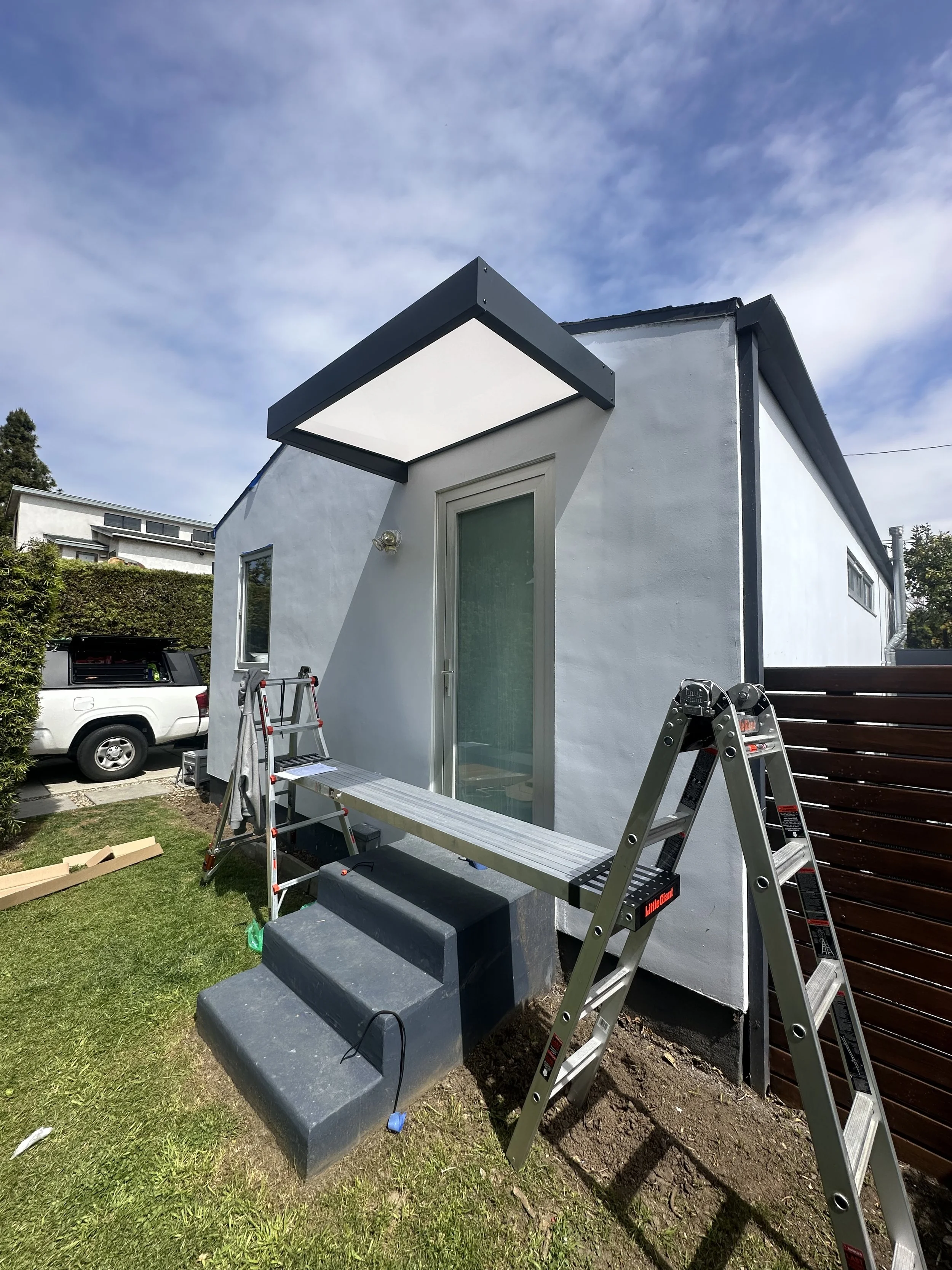 Exterior handyman project — modern overhang installation, screen door adjustment, and handrail prep in Los Angeles