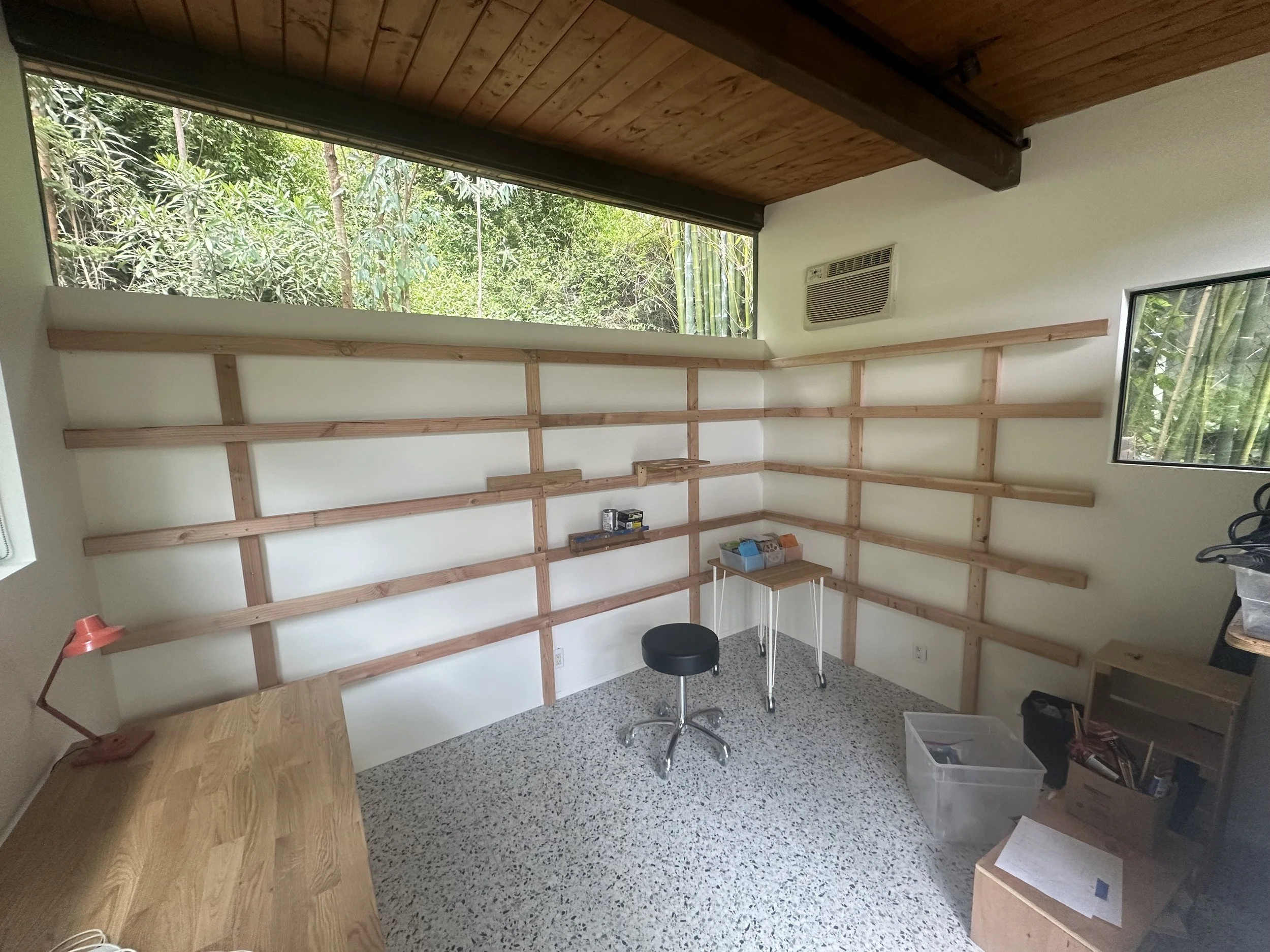 custom wood shelving installation in modern Beverly Hills art studio