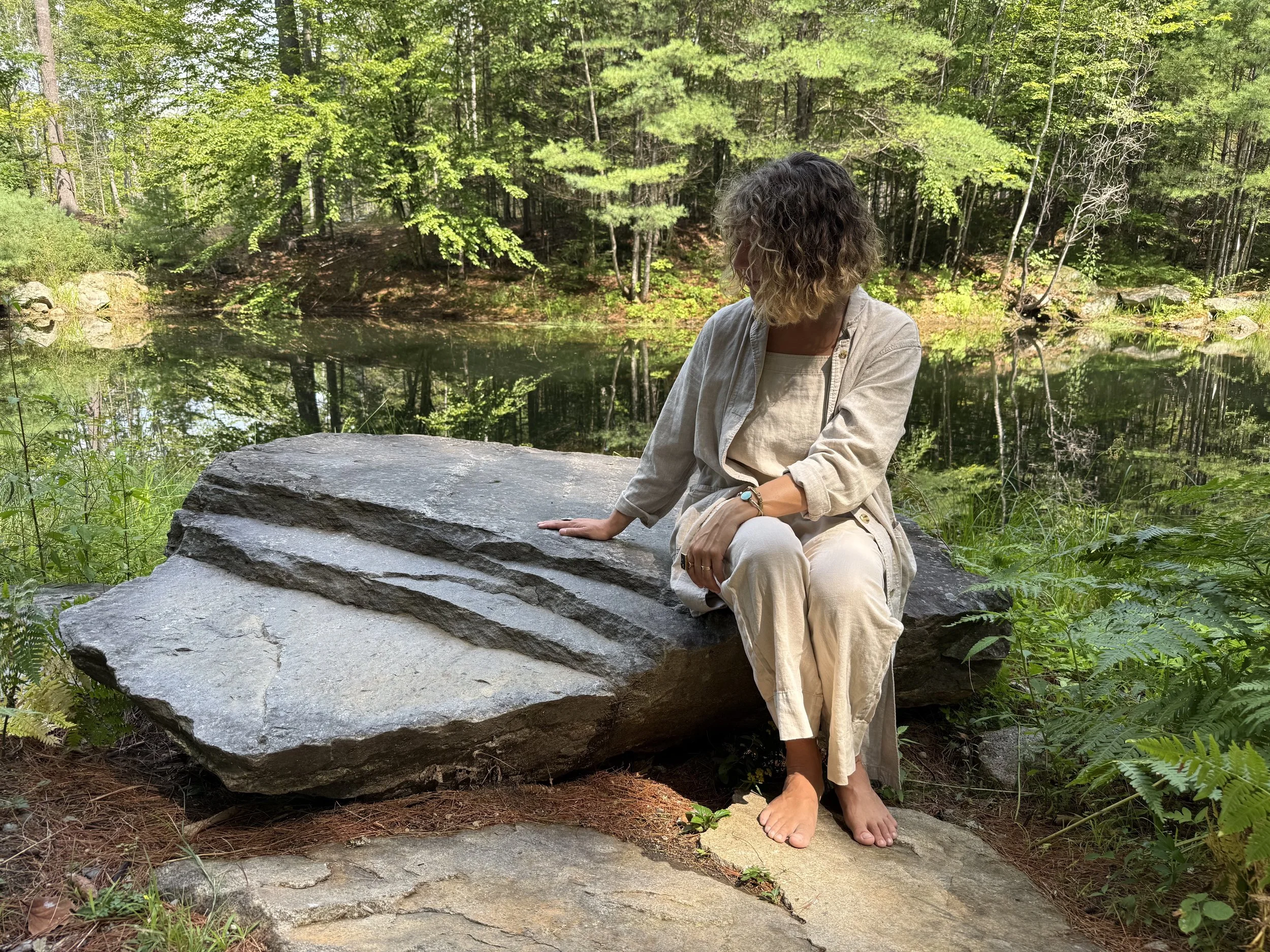 Meg at stone at the Upper Pond