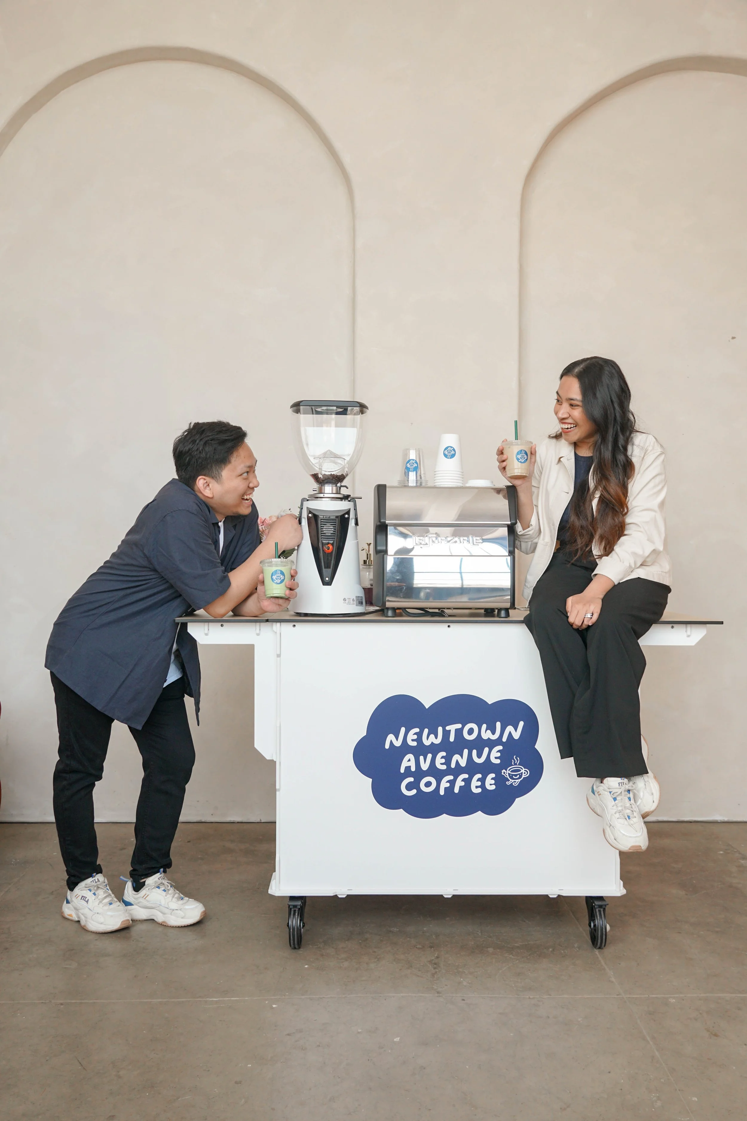 Aries and Anna the baristas of a coffee cart catering service Newtown Avenue Coffee for bookings in NYC and NJ