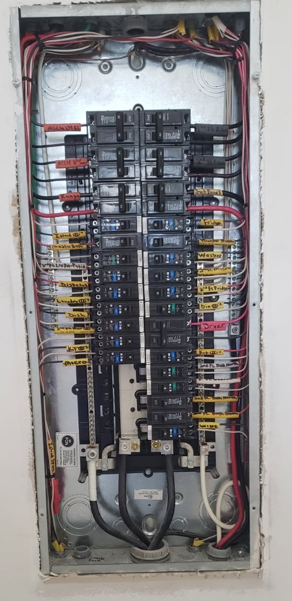 Interior view of an electrical circuit breaker panel with beautifully labeled wires!
