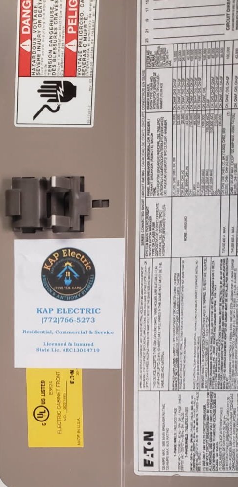 Electrical panel labeled with a service sticker from KAP Electric so you'll know who to call in the future!