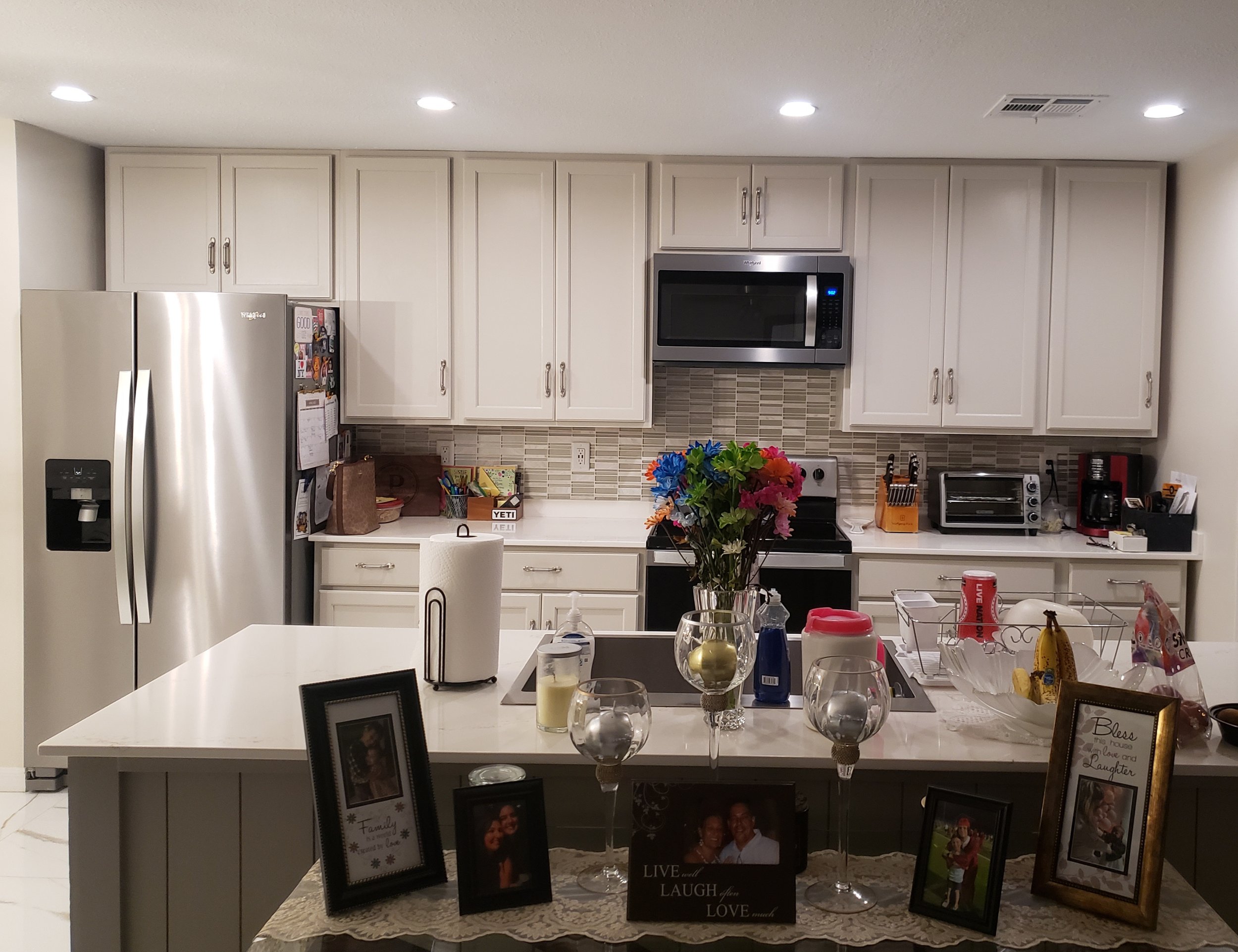 KAP Electric added recess cans in the ceiling to brighten up this kitchen.