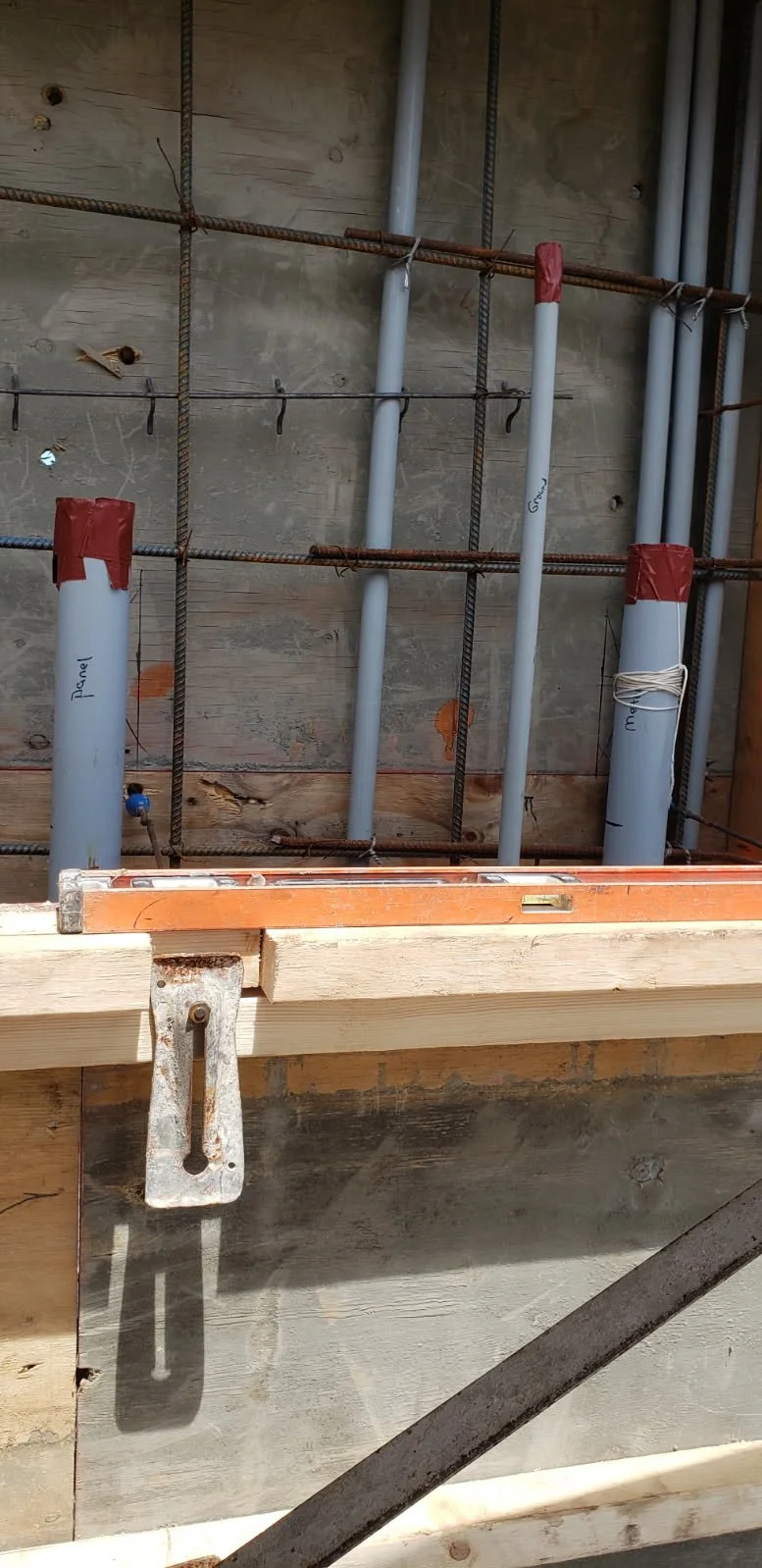 Precise pipe work for panel and disconnects in poured concrete wall of a commercial building done by Anthony!