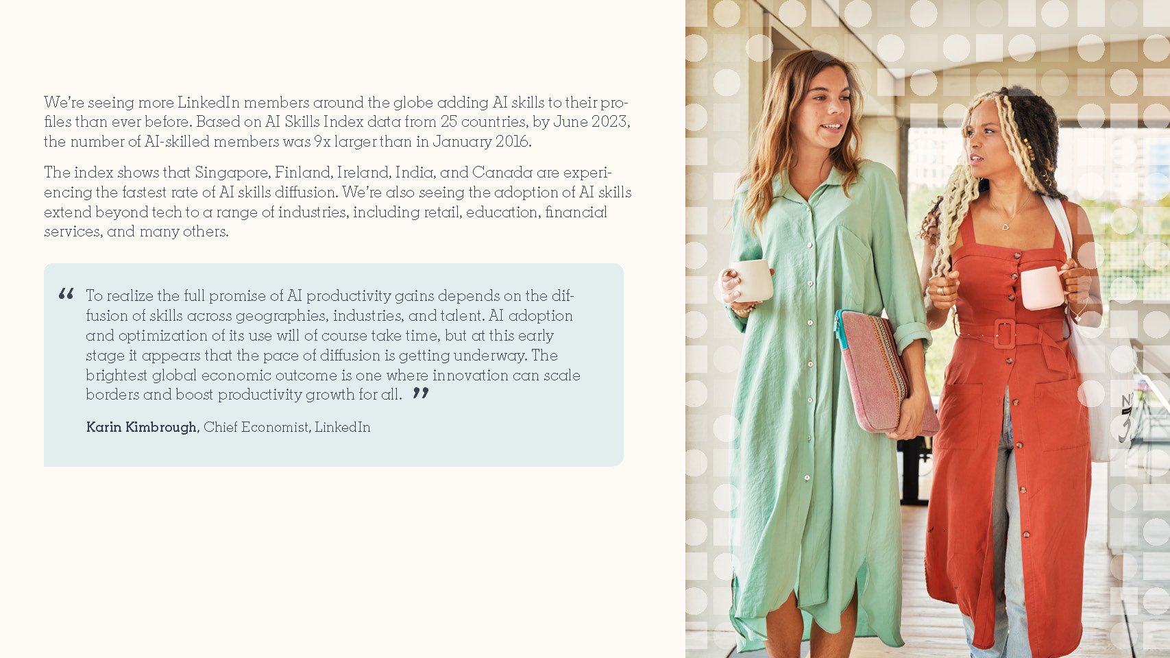 Two women walking together in an office, holding coffee mugs and chatty, one wearing a green dress and the other in a rust-colored dress with a waist belt, with a window showing city buildings in the background.