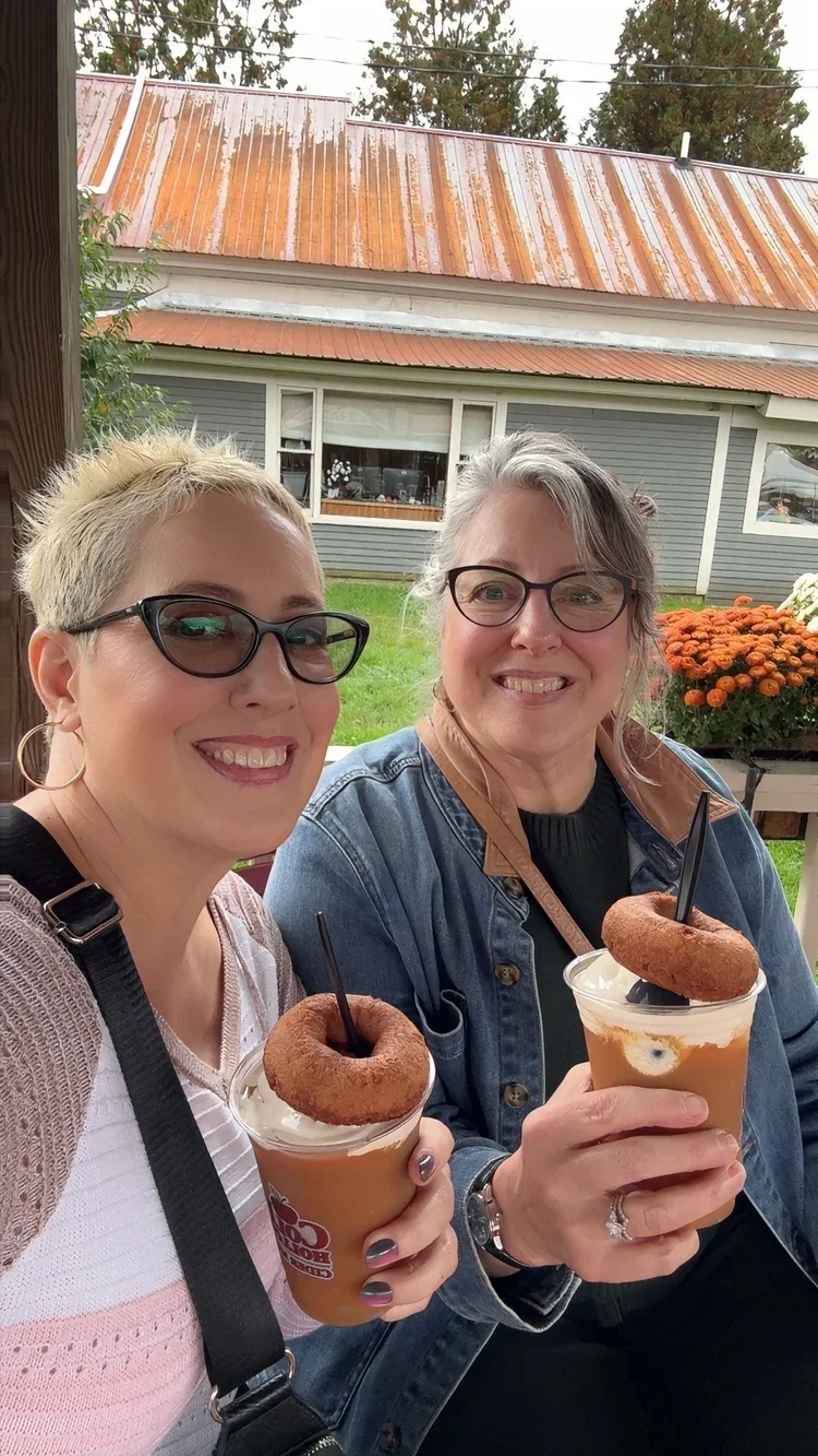 Kim and her sister celebrating her 60th birthday with ice cream donut slushies