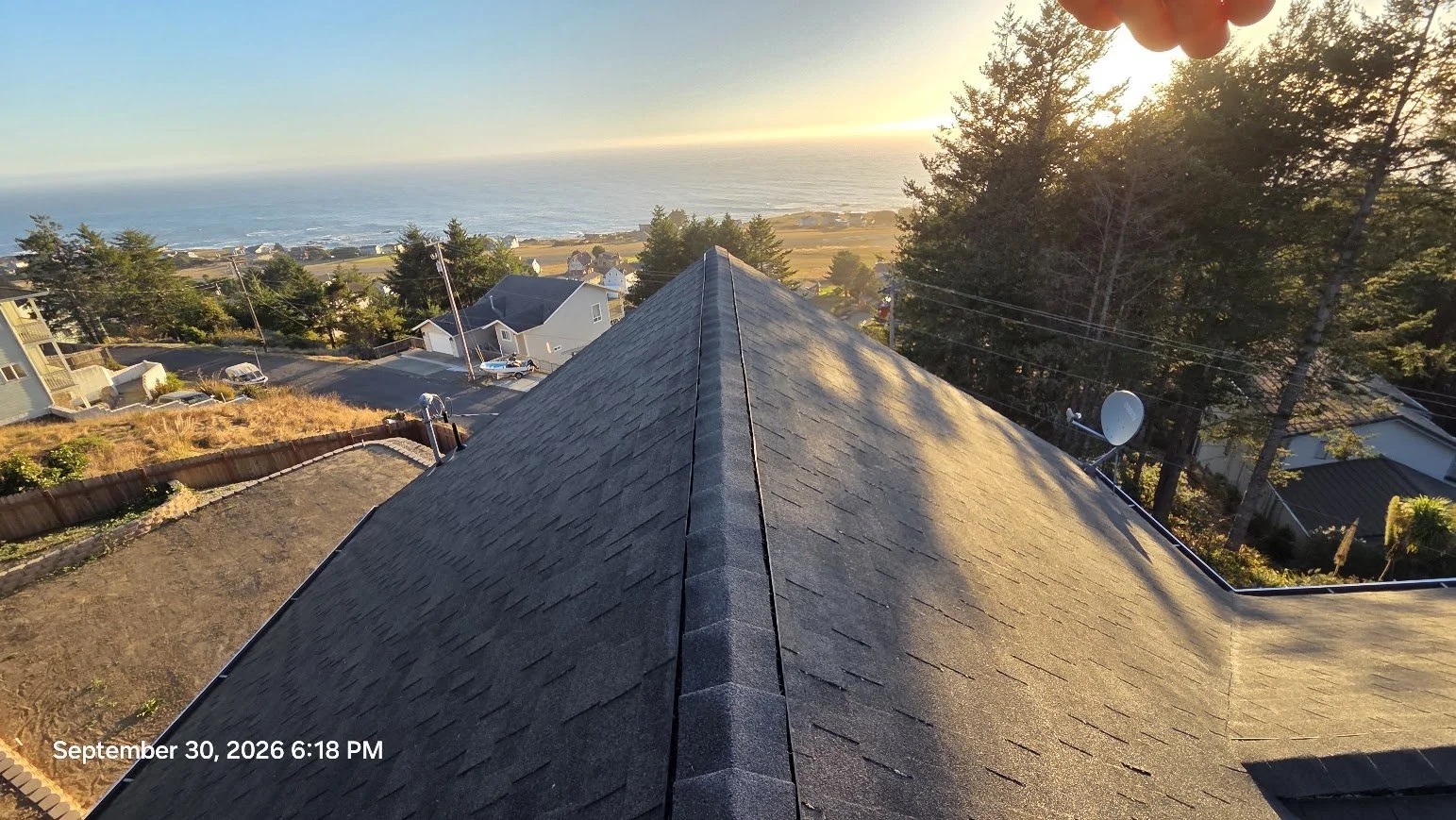Roof Moss Removal • Moss Treatment • Gutter Cleaning • A steep asphalt-shingle roof and second-story gutter project overlooking the Shelter Cove coastline.