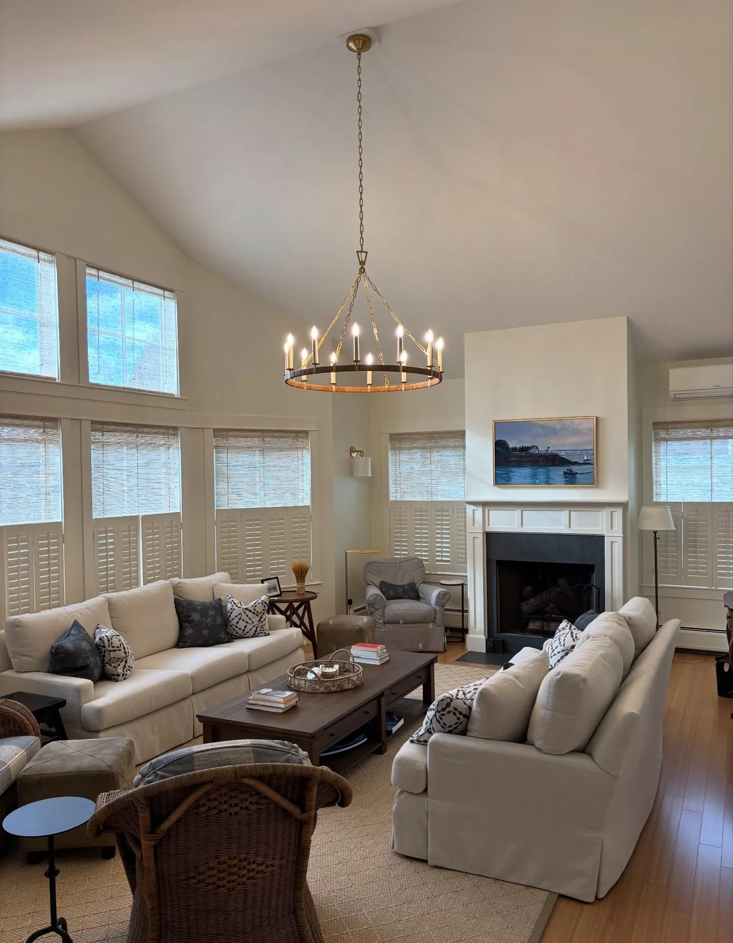 Tis the season we appreciate our lighting most here in Maine!  This beautiful @visualcomfort chandelier is a rattan-wrapped update of the classic Darlana Ring Chandelier. It was installed recently in a living room we designed while working at @hayrun