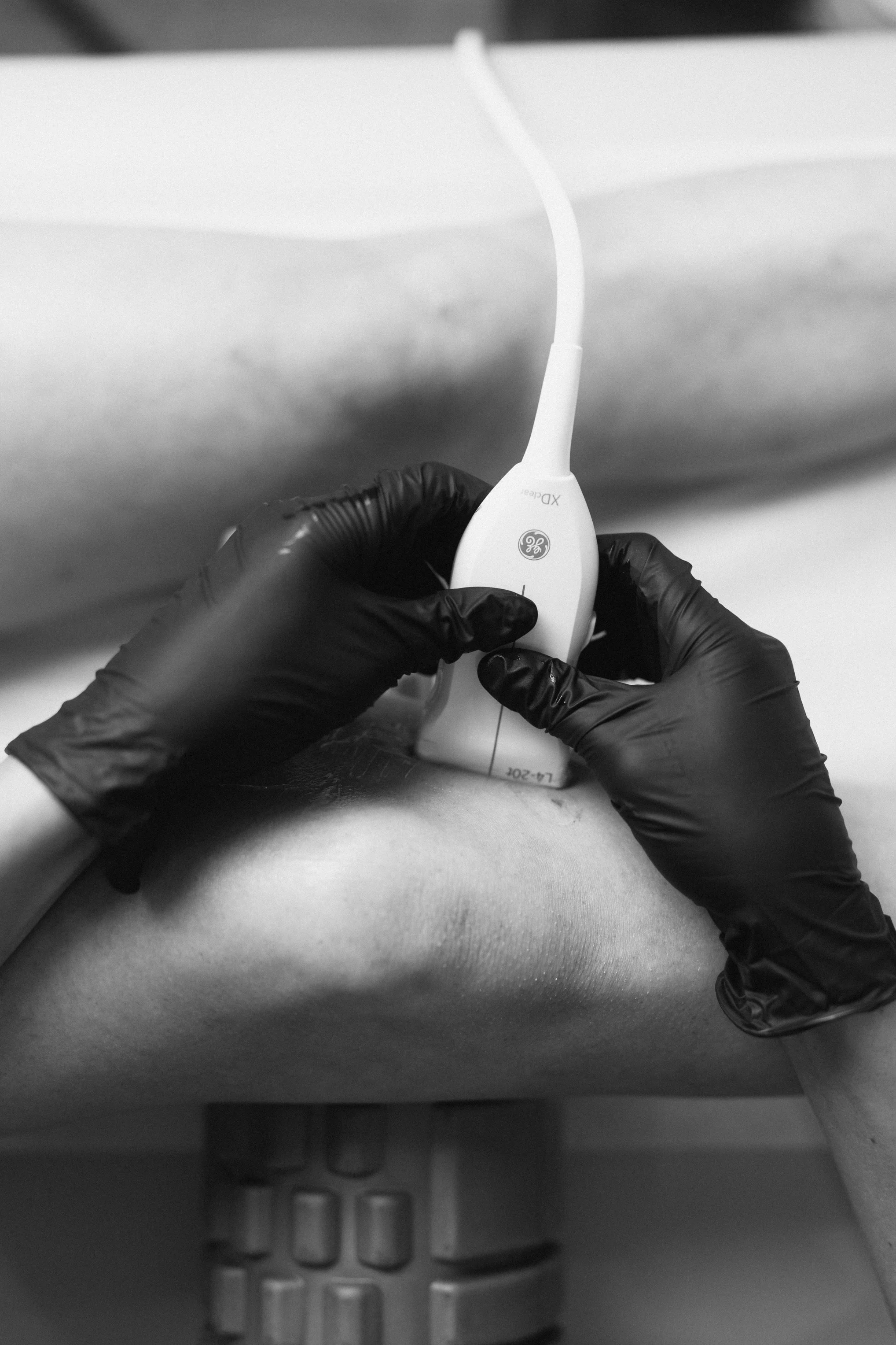 Dr. Rollheiser, ND performing ultrasound-guided injection for pain, using PRP, Prolotherapy, Corticosteroids, Hyaluronic Acid.