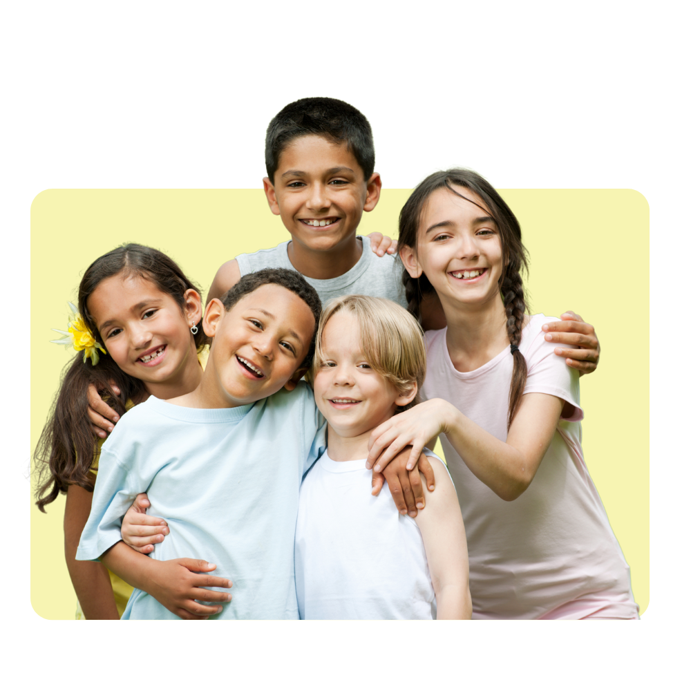 Group of six happy children hugging each other against a yellow background.
