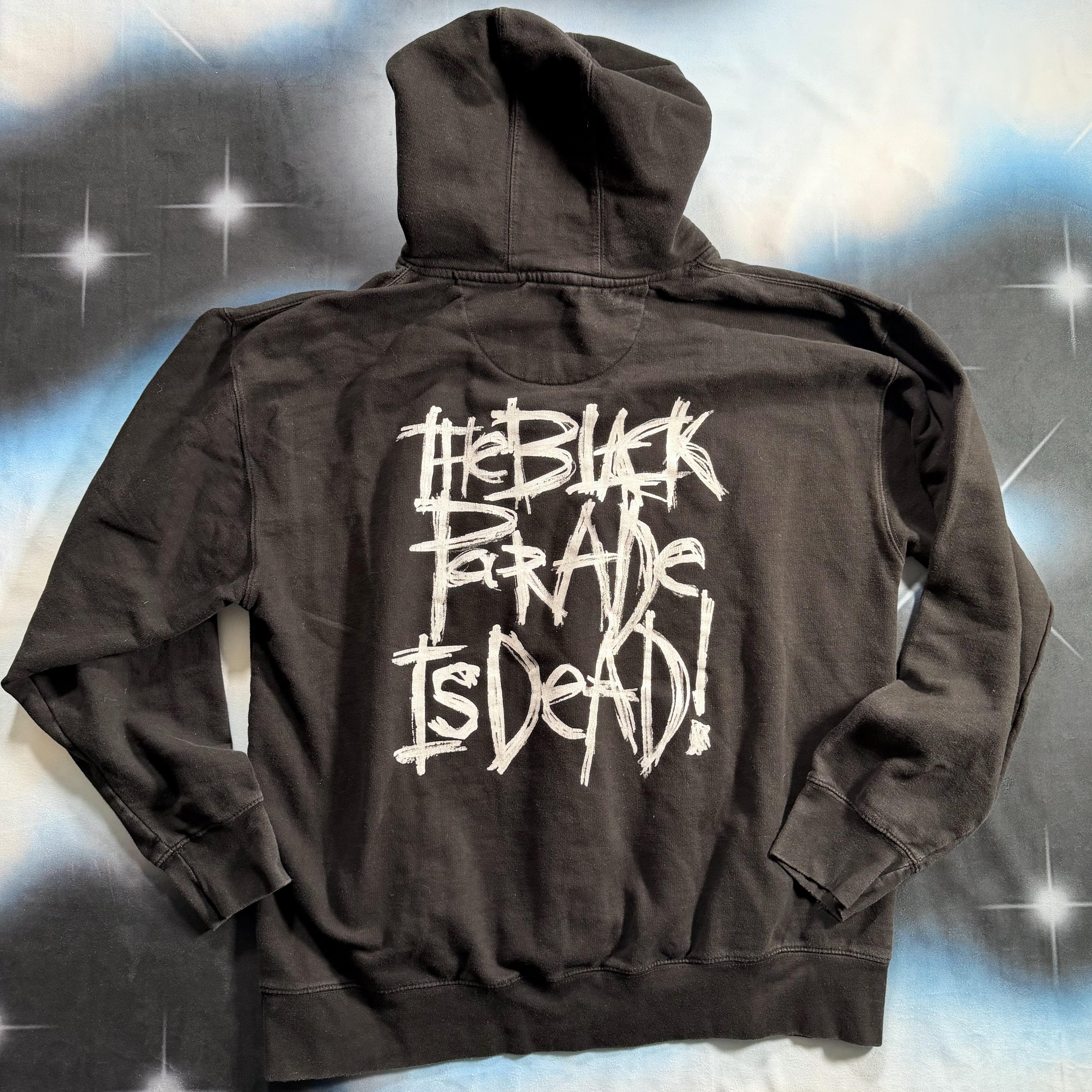 Back of MCR Black Parade is Dead! hooded sweatshirt against a y2k style starry night sky backdrop