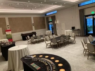 Empty event room with casino tables and chairs