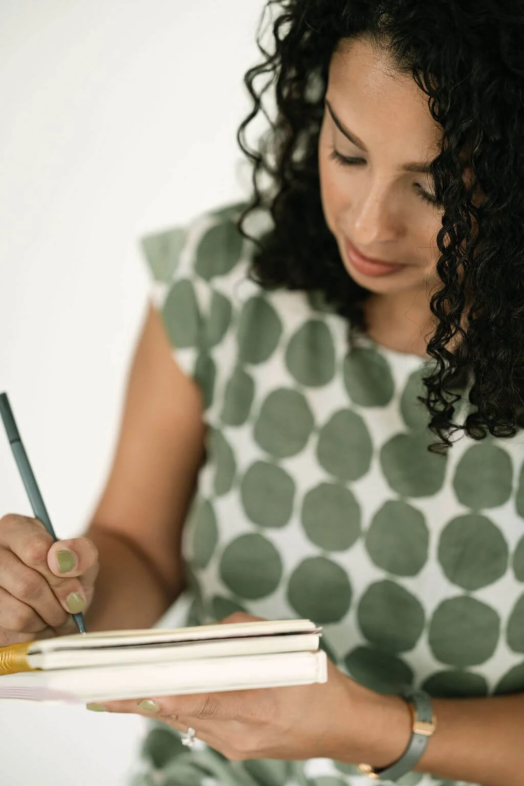 Christina Martin Kenny, fundraising consultant, writing in notebook.