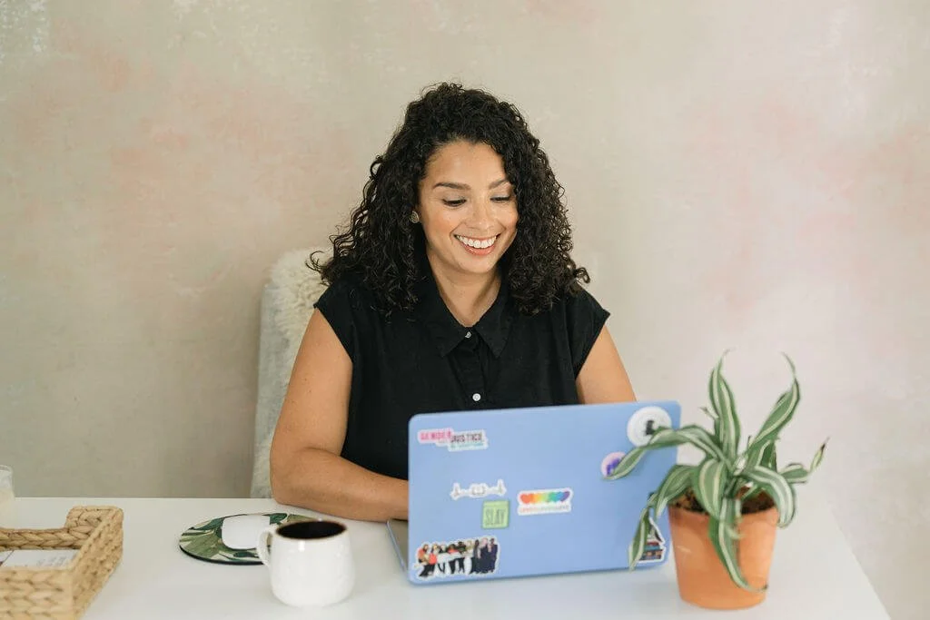 A nonprofit fundraising consultant writing in a notebook before drafting a director of development job description.