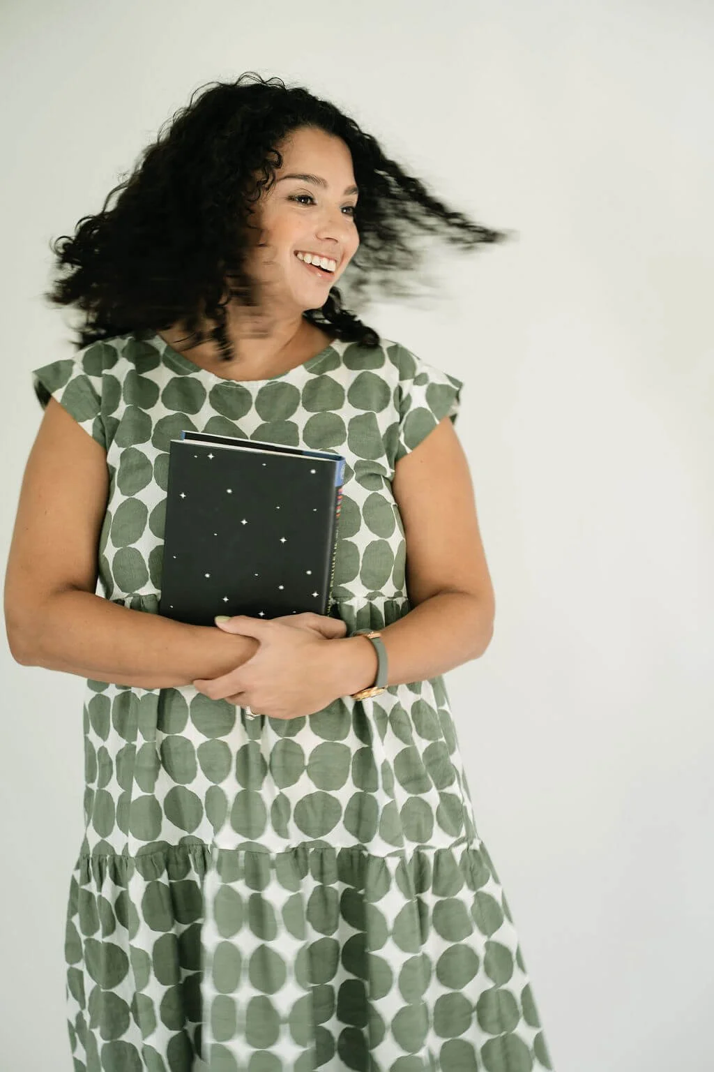 Christina Martin Kenny, nonprofit fundraising consultant, smiling and celebrating a client's fundraising win.