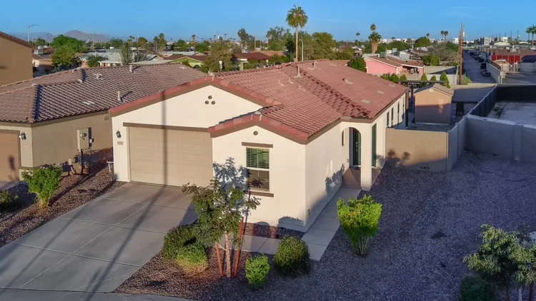 Aerial photo of a home with a mountain backdrop