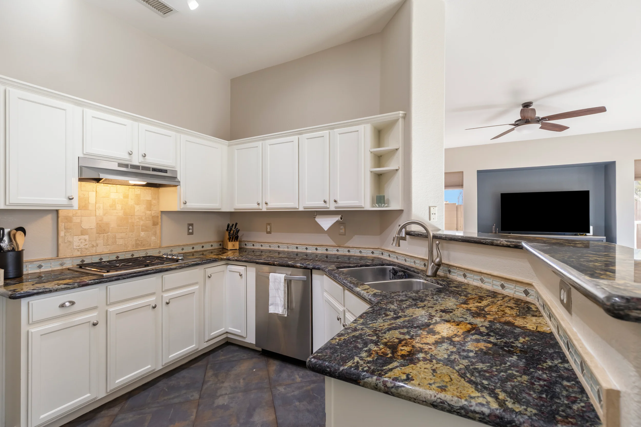 Clean and staged kitchen with clear countertops ready for professional real estate photography