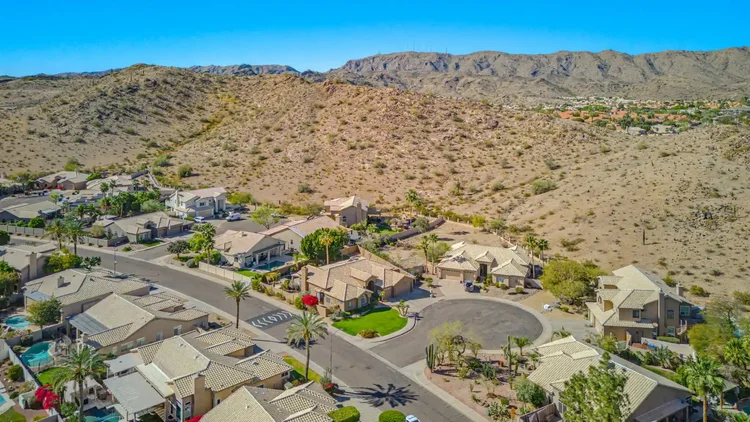 Aerial photo showing a lot and mountain views