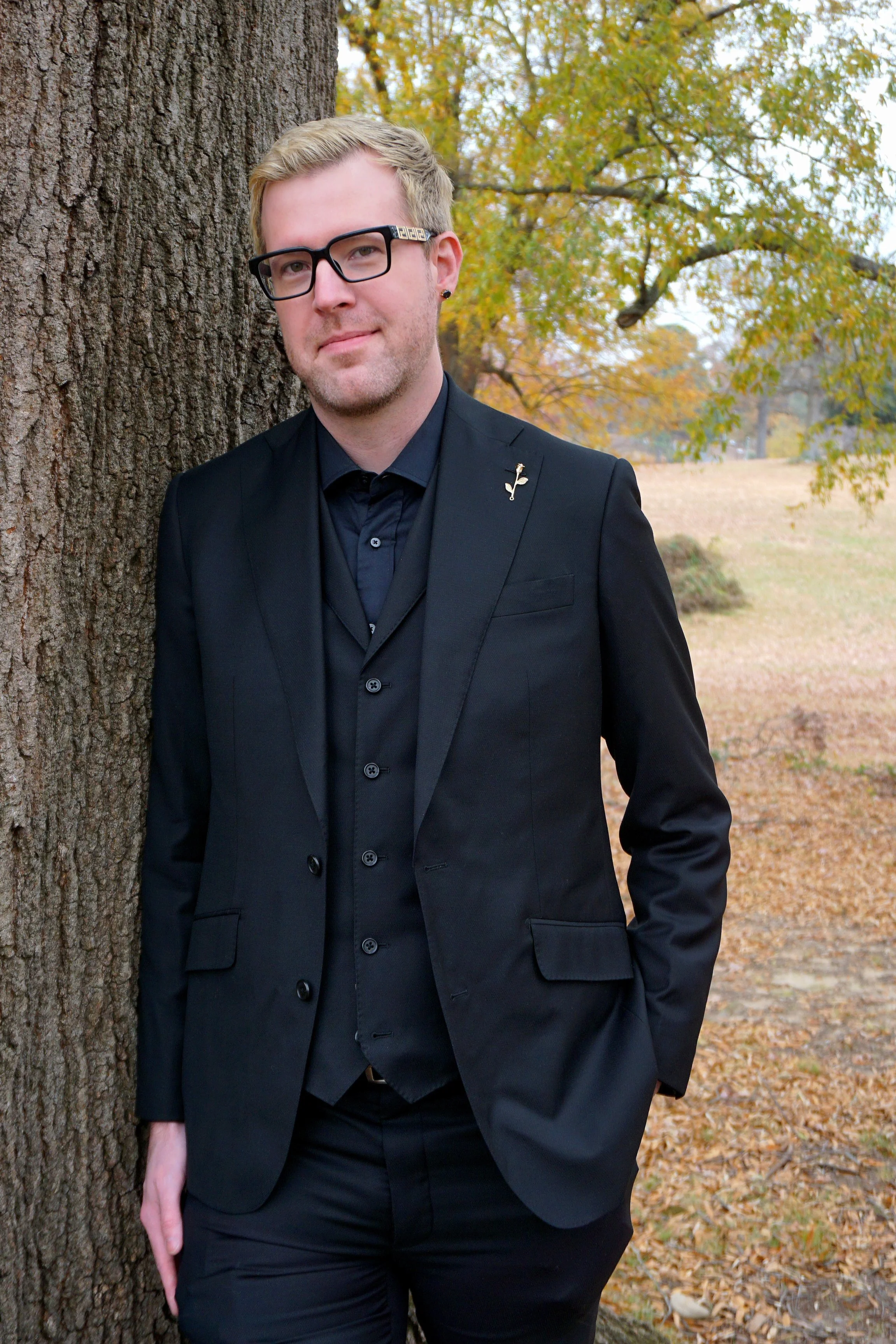 A man in a custom black suit in Richmond, Virginia.