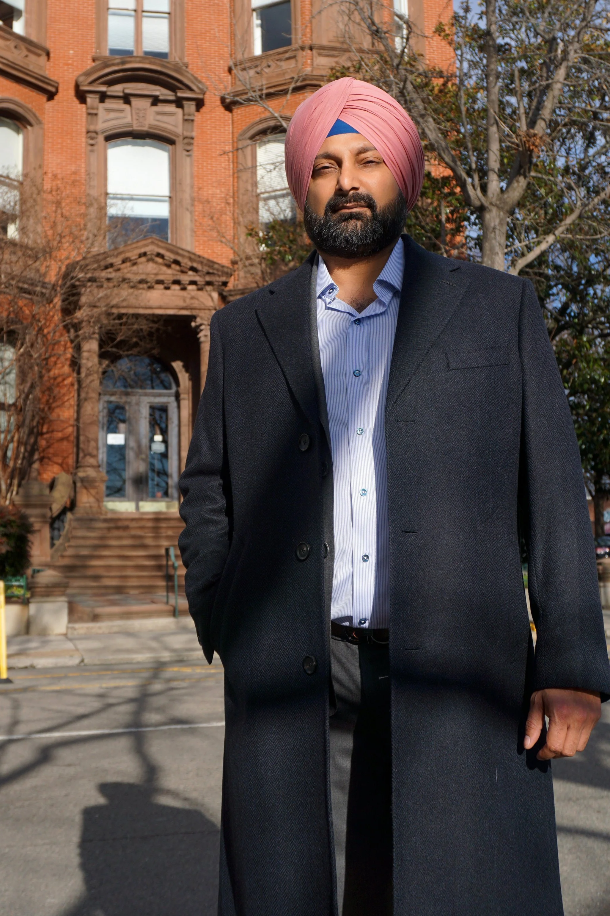 A man in a custom grey Gladson overcoat in Richmond, Virginia.