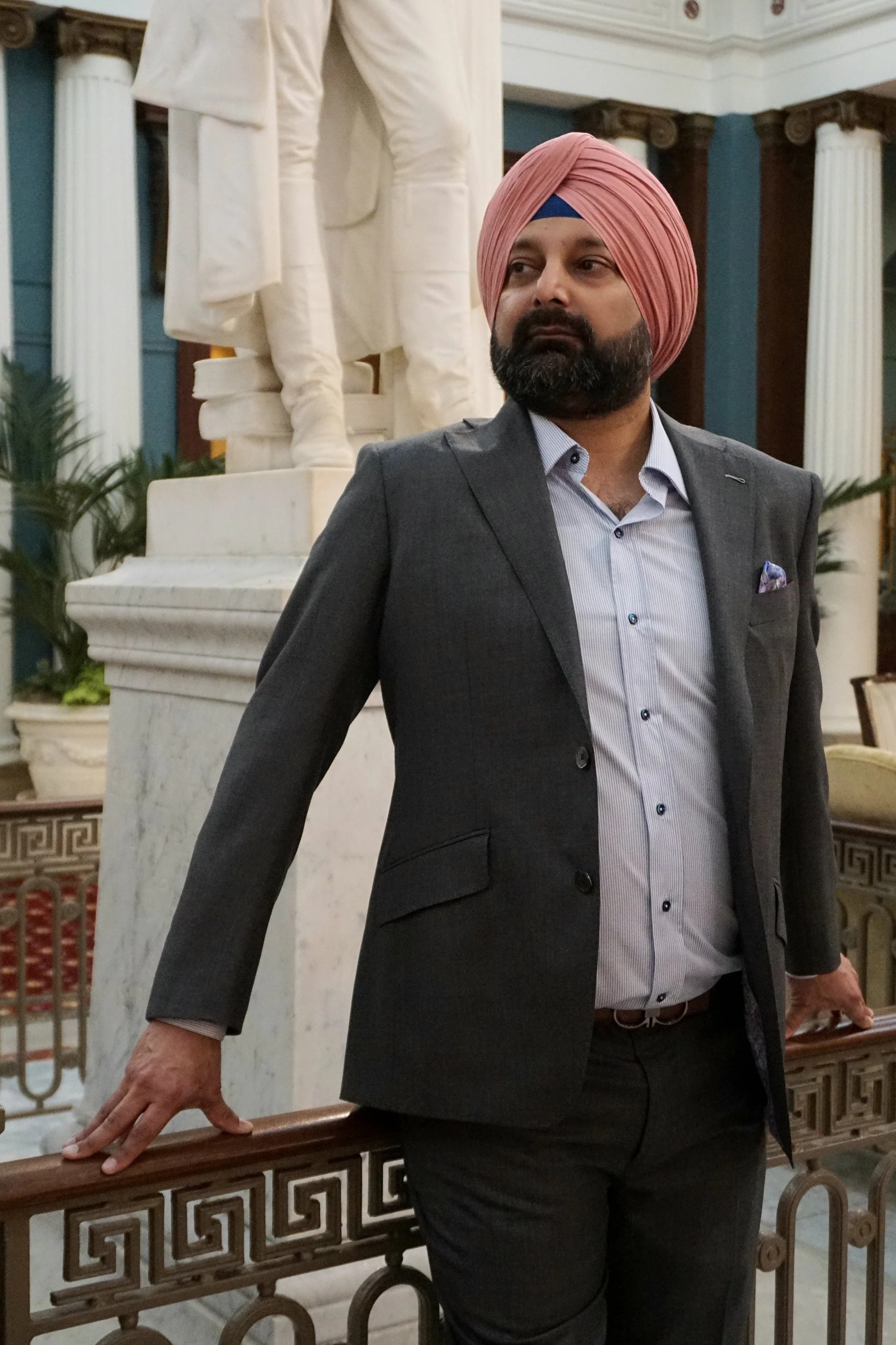 A man in a custom Dormeuil grey suit in Richmond, Virginia.