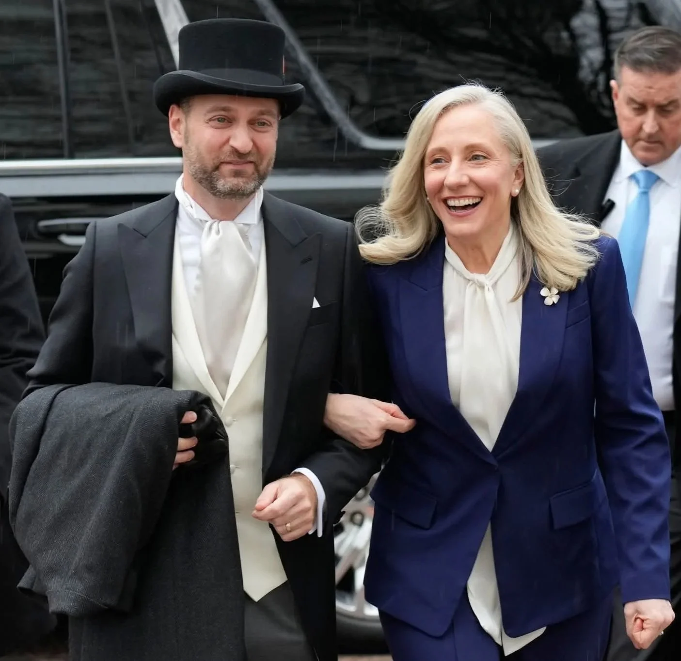 First Gentleman Adam Spanberger in a custom Dormeuil morning suit, with Governor Abigail Spanberger.