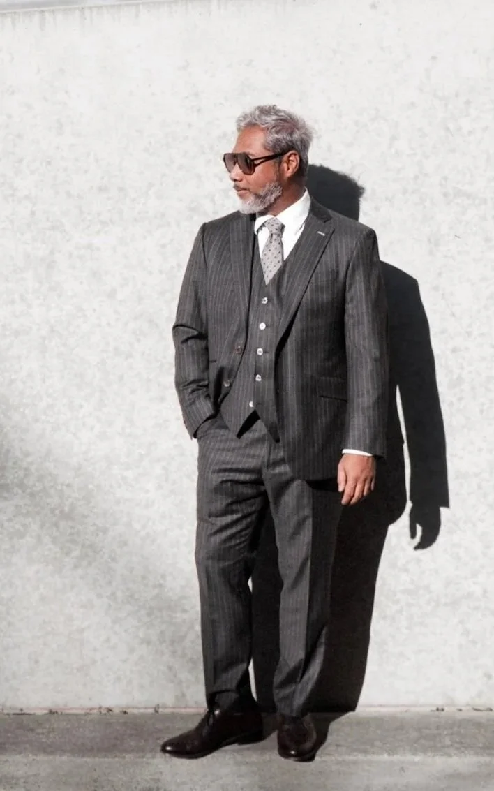 A man in a grey pinstripe Dormeuil suit in Richmond, Virginia