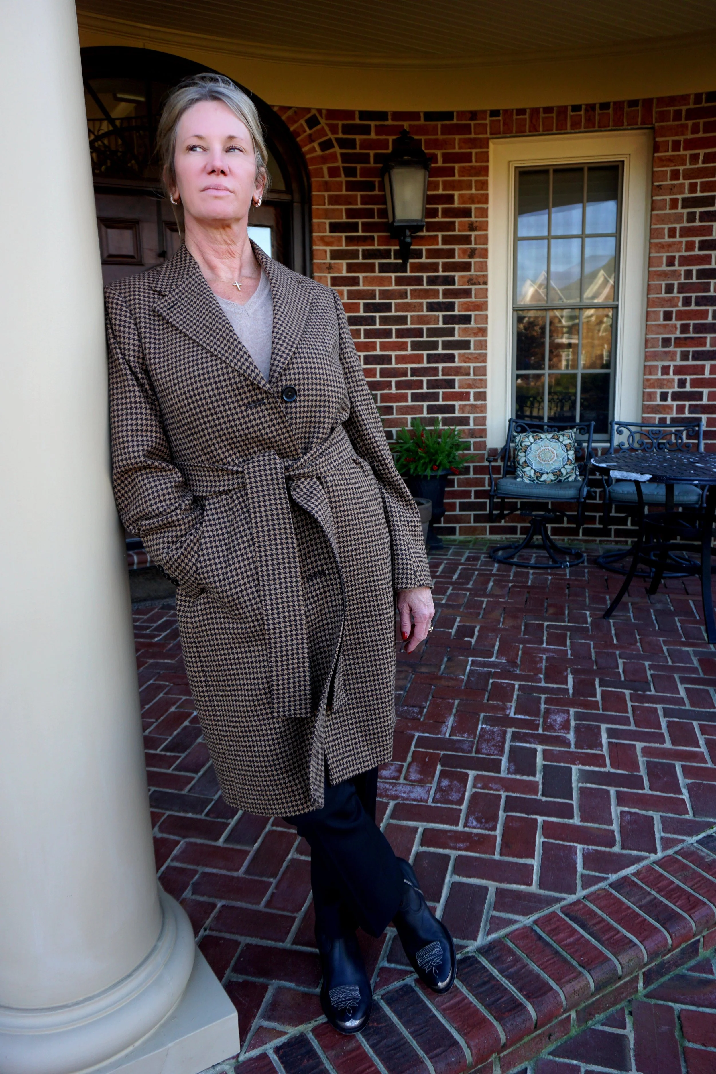 A woman in a custom Gladson brown overcoat in Virginia Beach, Virginia.