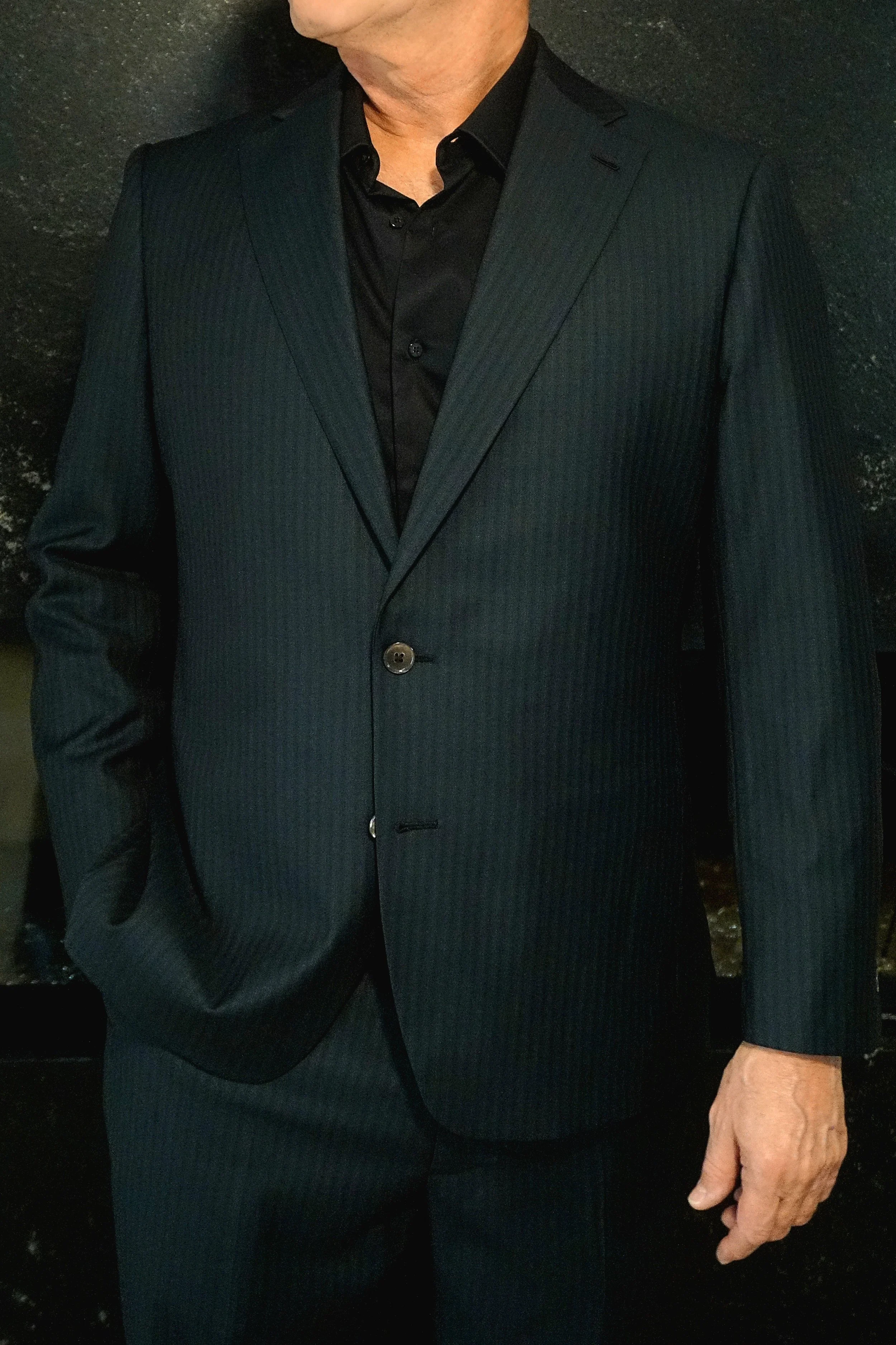 A man in a custom teal stripe suit in Richmond, Virginia.