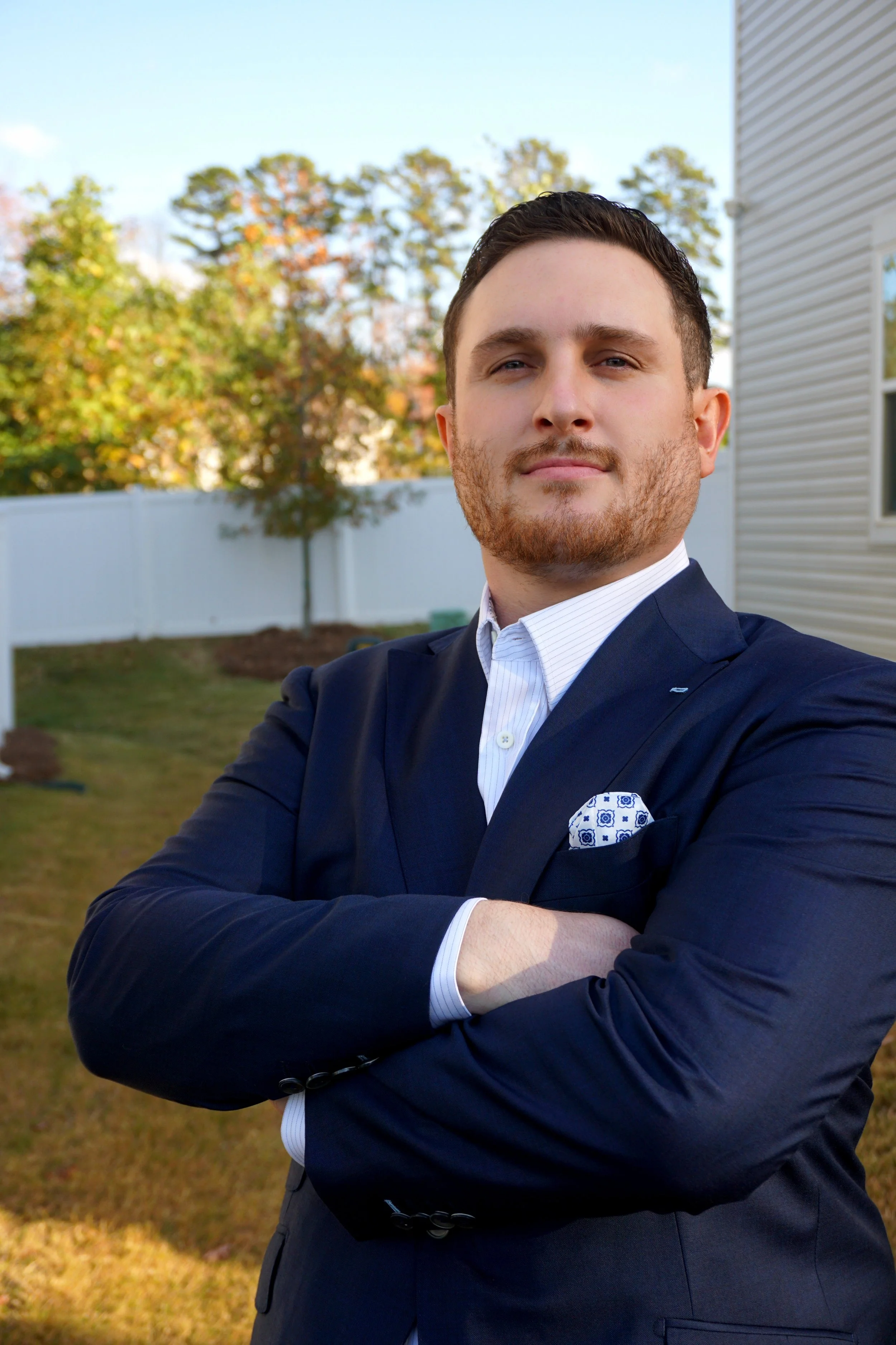 A man in a custom navy suit in Charlotte, North Carolina.
