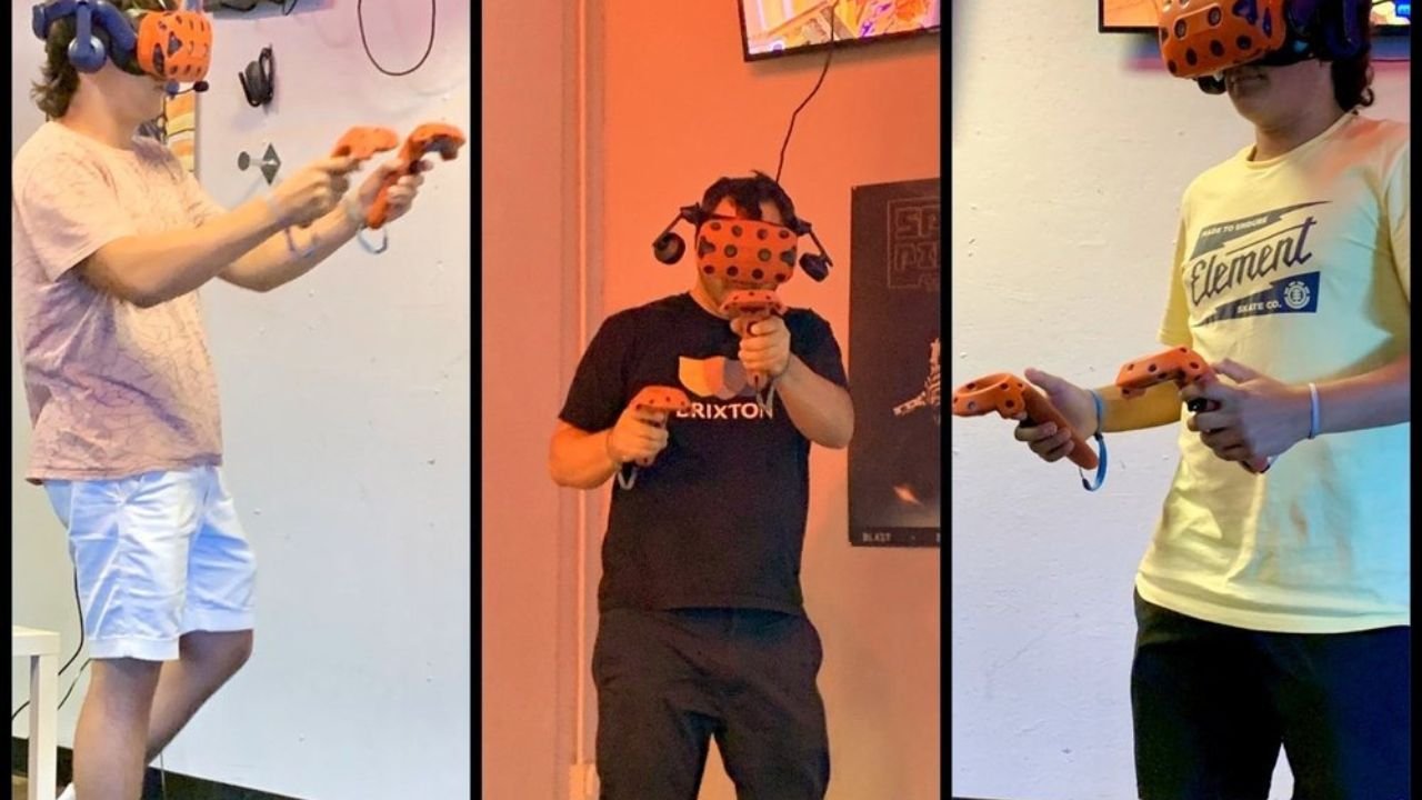 3 heroesvr customers wearing VR headsets