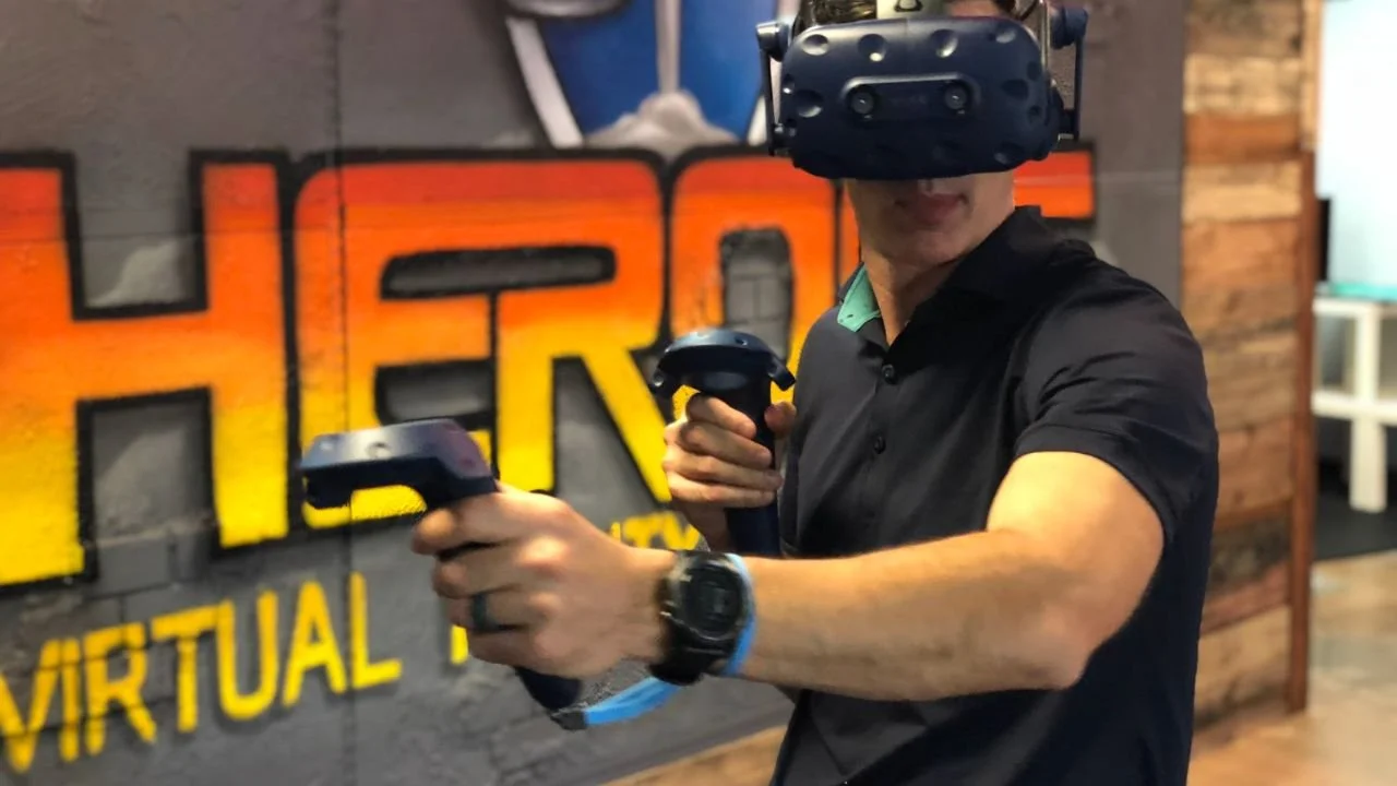 A participant explores a multiplayer VR experience at HEROES VR.
