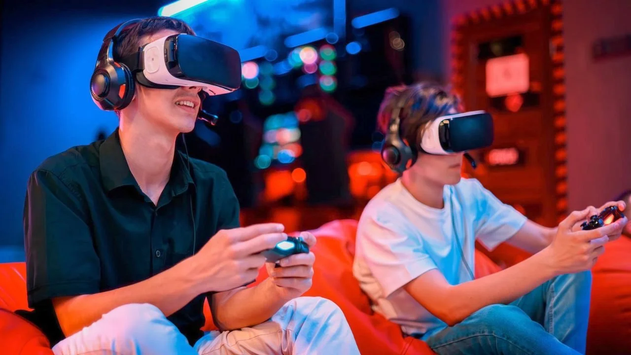 Two teenagers enjoying VR games, a popular activity in teen birthday party ideas today.
