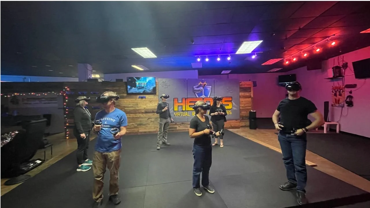 6 Team Members in VR headsets solving a puzzling VR Escape Room