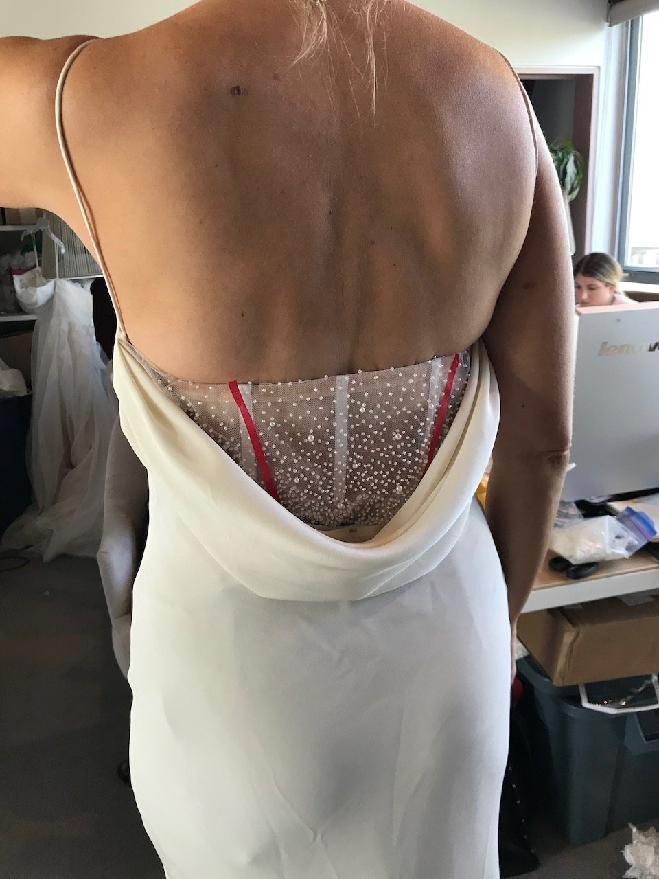 The back of the slip, with beaded-back corset slip underneath.