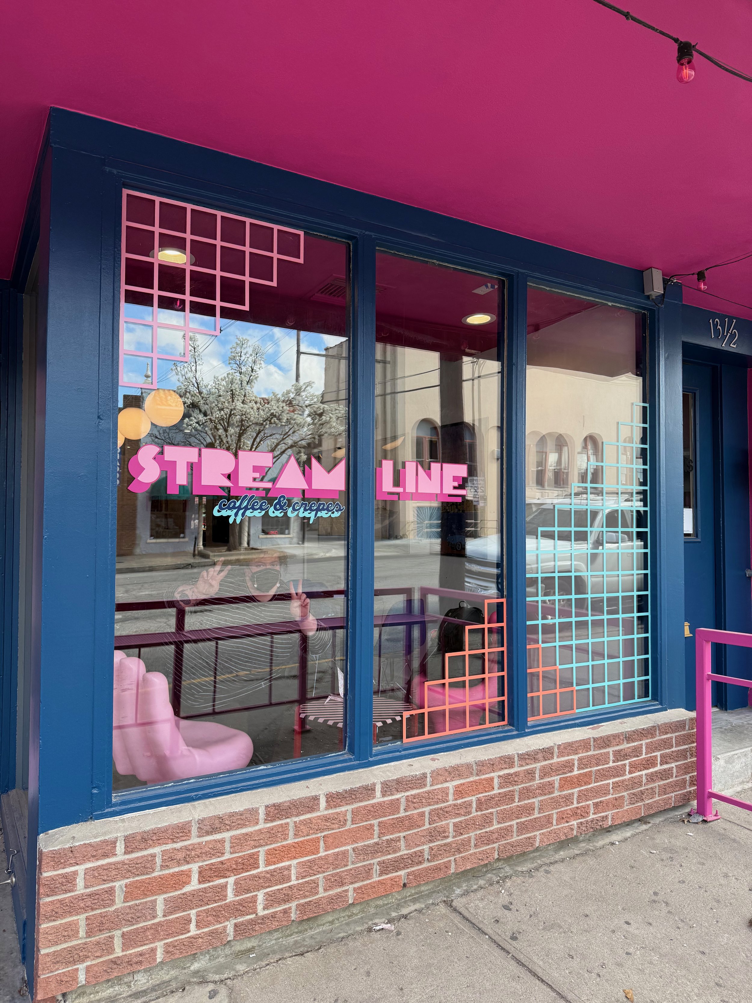 The exterior signage carried through the grid motif brand identity through the bold and playful color choices. The owner said pedestrians could not walk by without stopping and peeking inside in the days and weeks before opening.