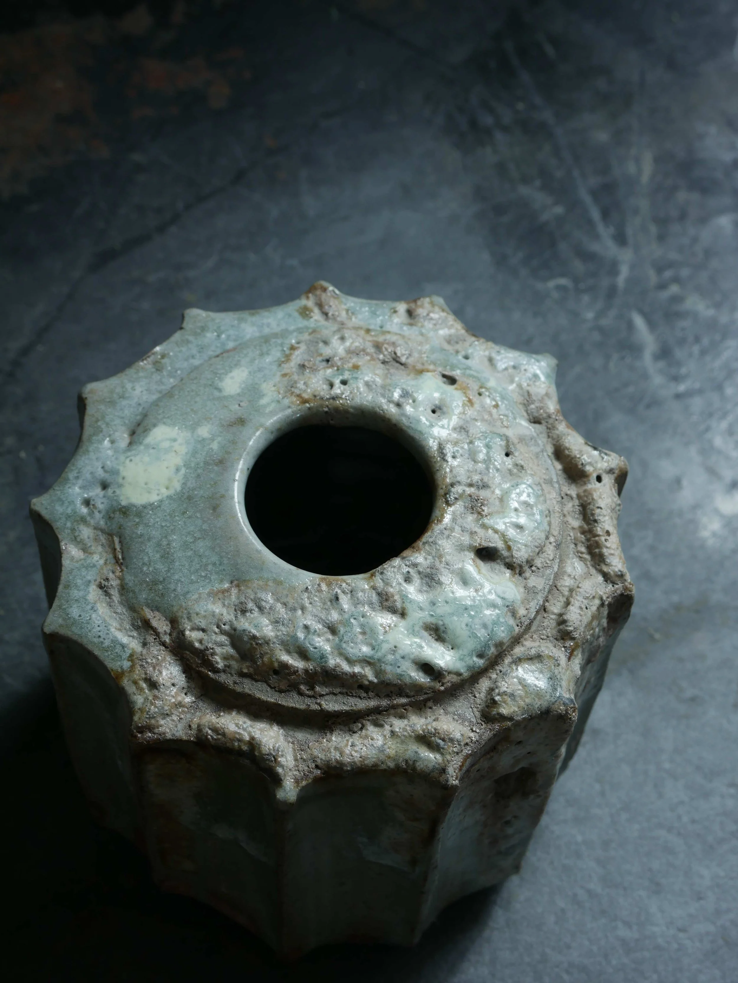 jar with cog ratchet design and bubbling glaze texture by Andy van Vliet