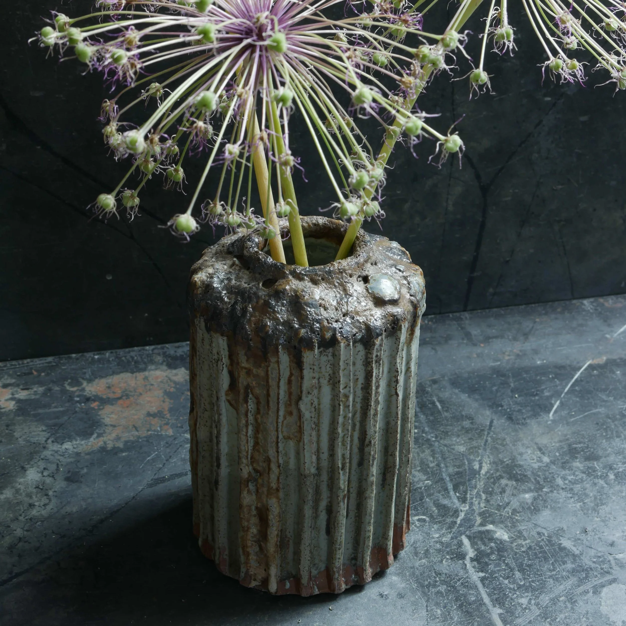 ribbed vase in green celadon and black glazes glaze